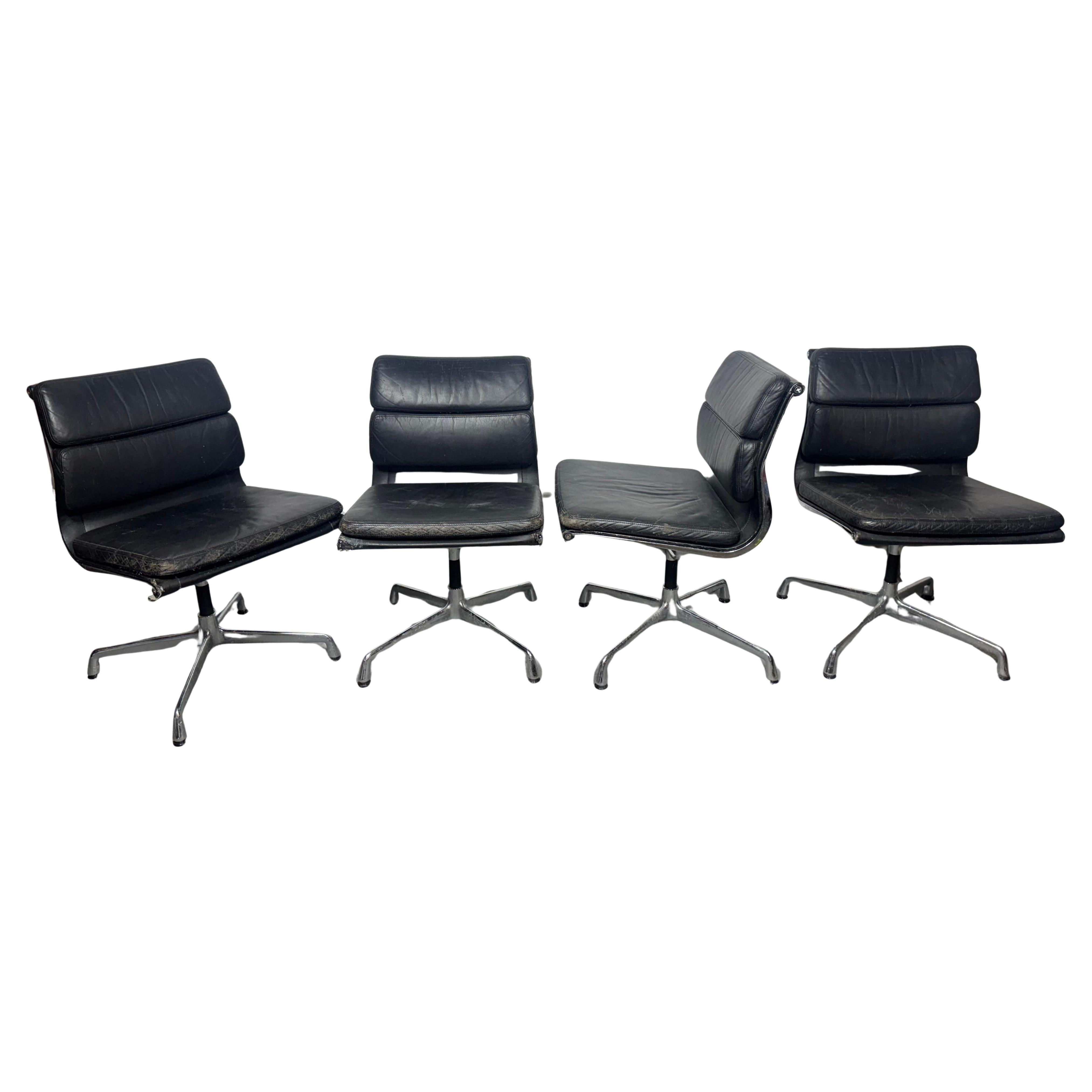 Set 4 Eames black leather chairs, model Soft Pad EA 205 For Sale