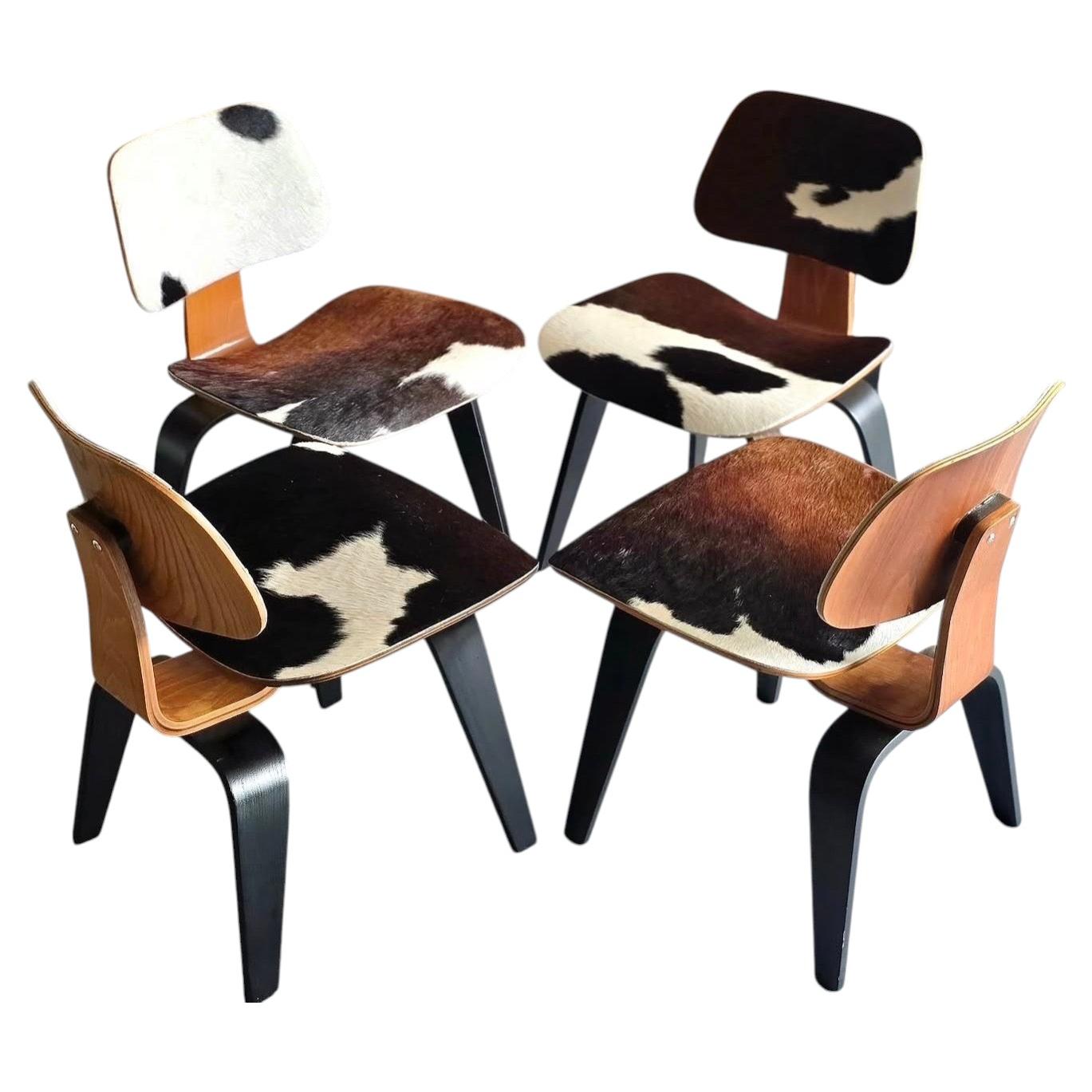 Set 4 Early Charles Eames D C W's (dining chairs wood) restored in cowhide