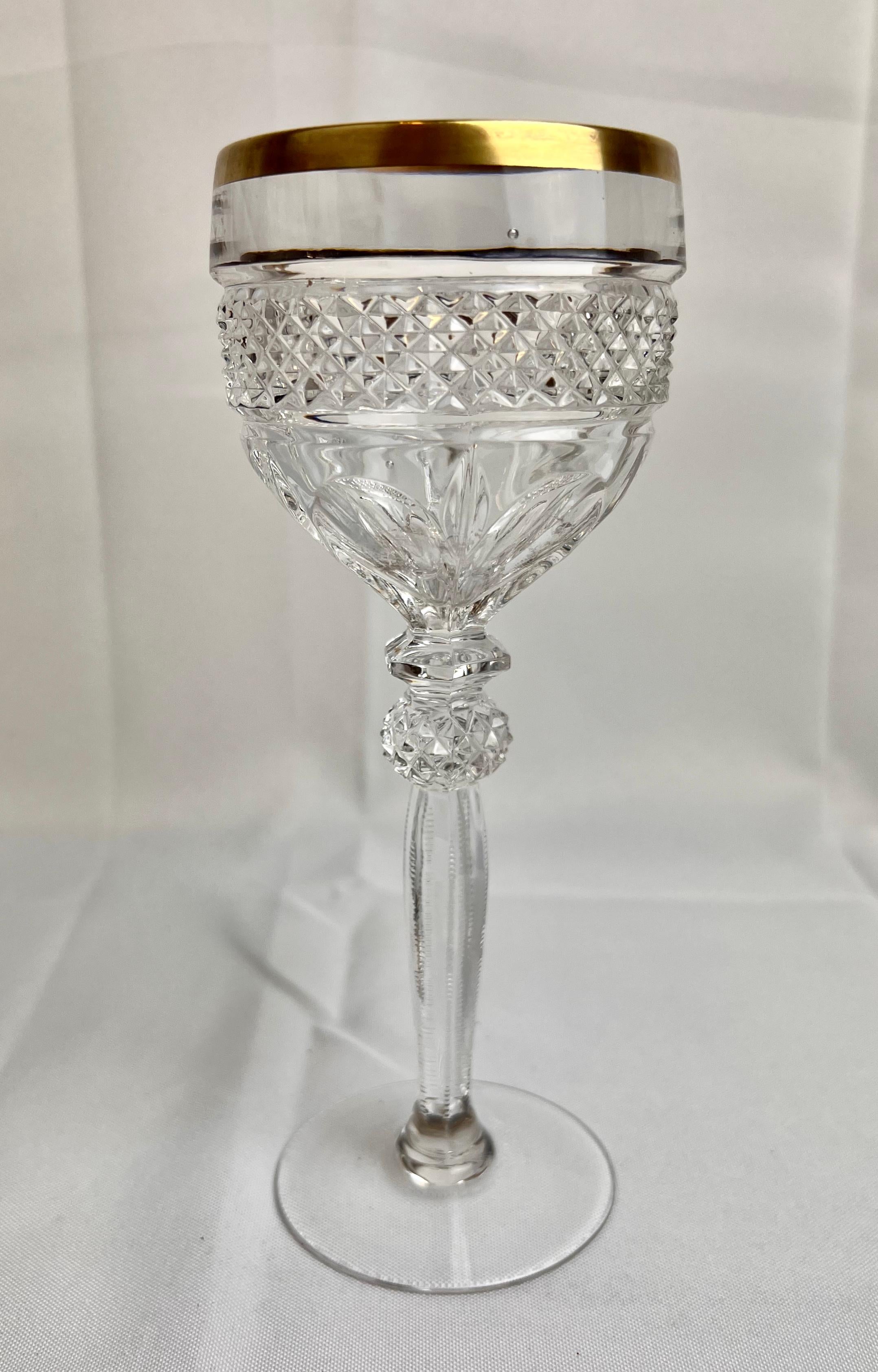 Set of four gilt edged cut crystal wine glasses. They have a nice heft in the hand and reflect light nicely. At 8
