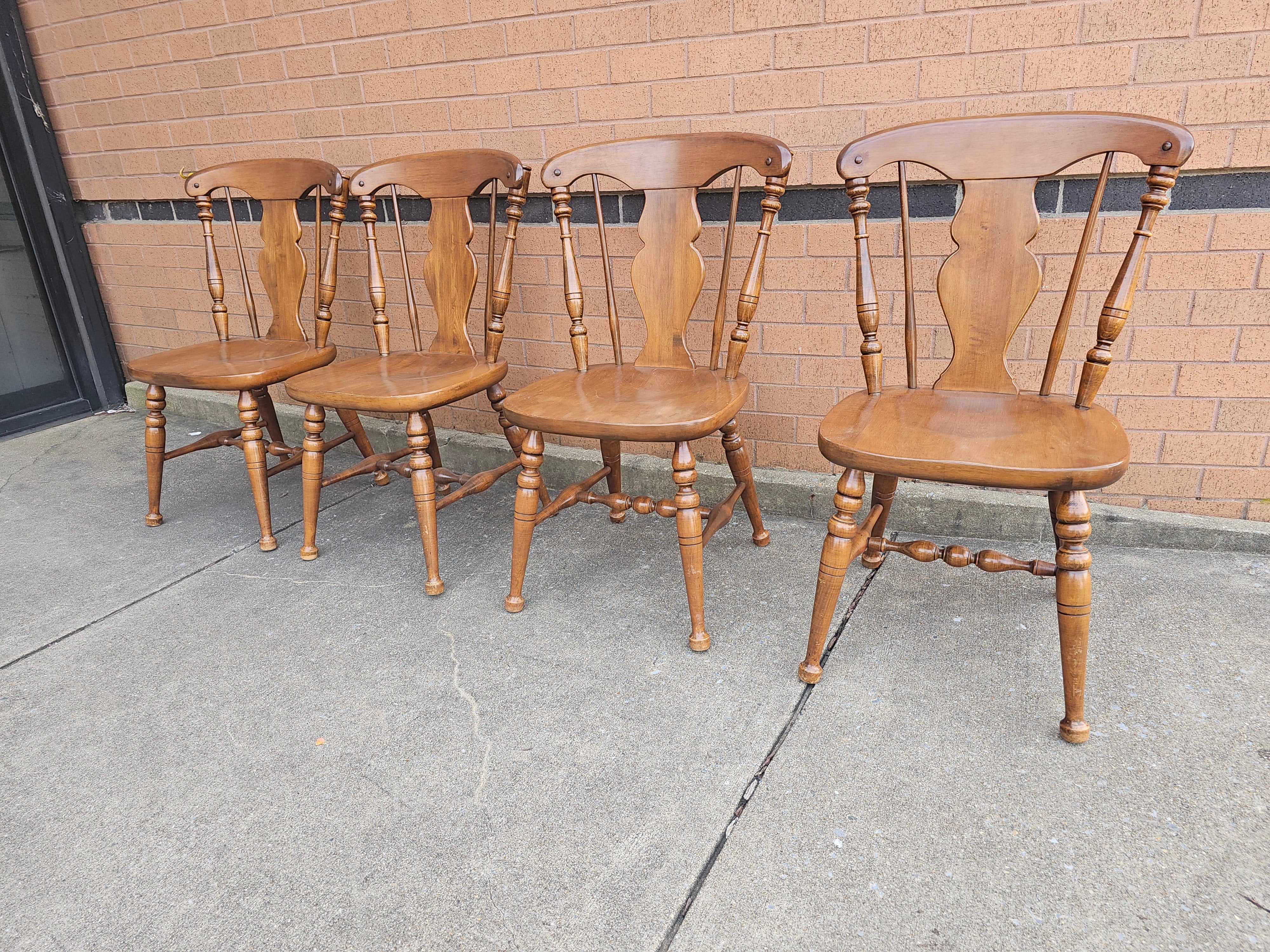 Set of 4 Heywood Wakefield solid Hard Rock Maple Cinnamon Colonial Style Splat Back side Chairs in good vintage condition. 