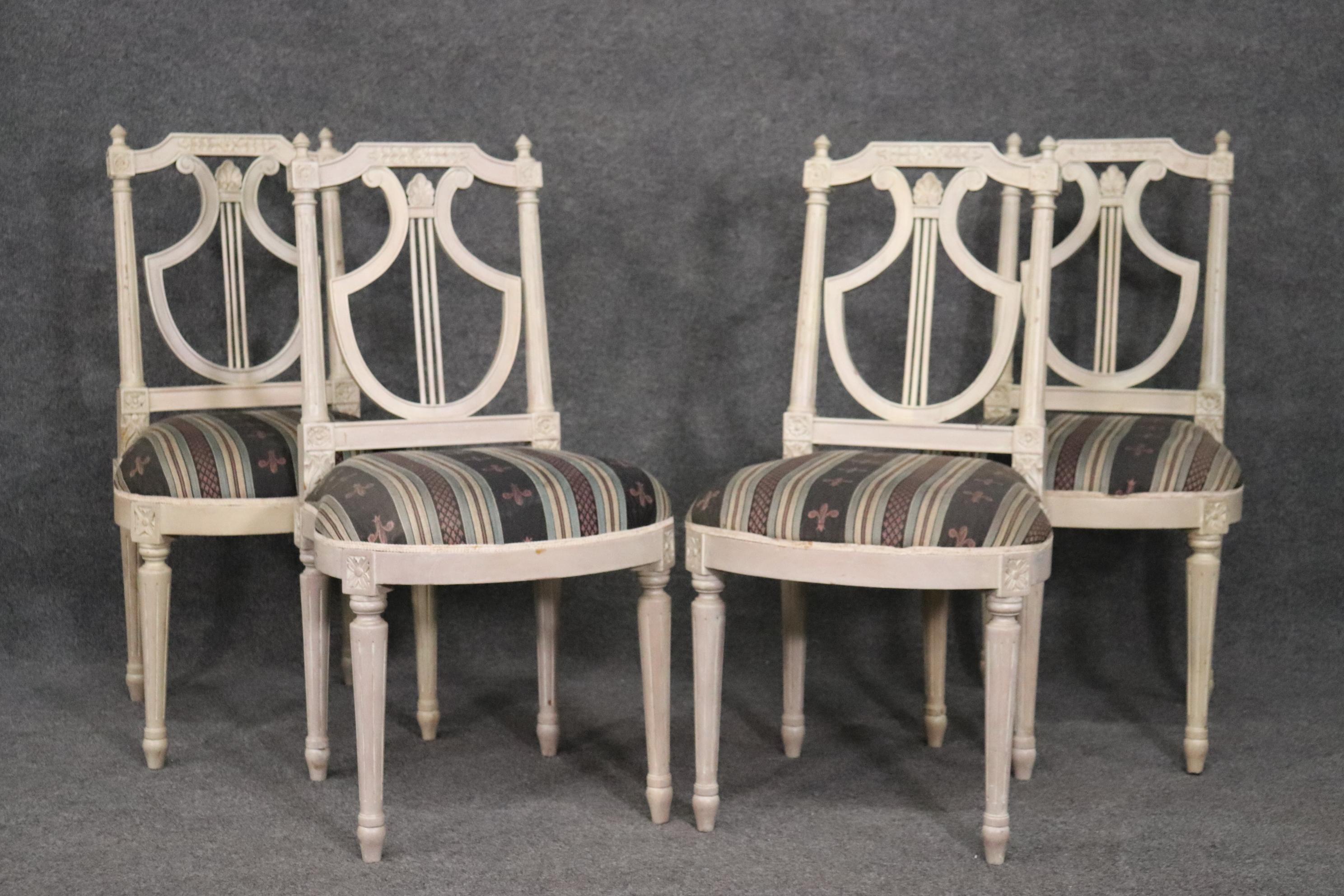 This is a gorgeous set of Maison Jansen dining chairs. Looking for sets of 4 beautiful chairs can be exhausting because they are very hard to find. This set of signed Maison Jansen chairs is in a beautiful antique white finish with attractive