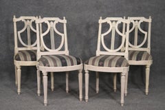 Ensemble de 4 chaises de salle à manger à dossier lyre peintes de la Maison Jansen Circa 1950