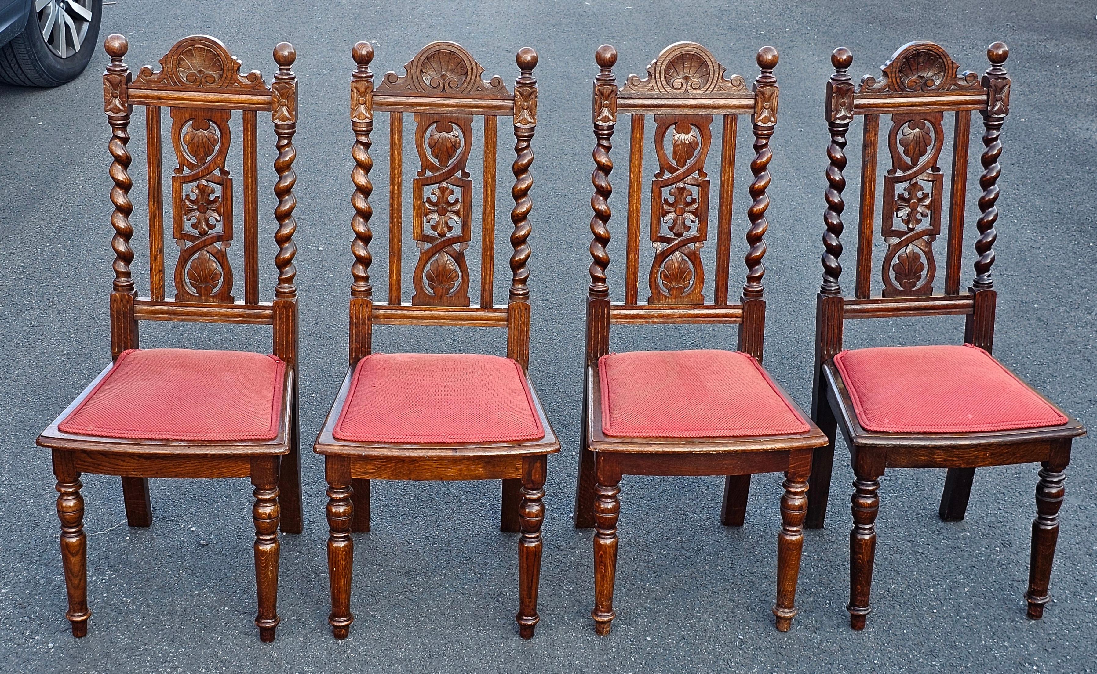 A Set of four Mid 20th Century Jacobean Style Carved and Barley Twist Oak and Upholstered Seat Side Chairs
Measures 17