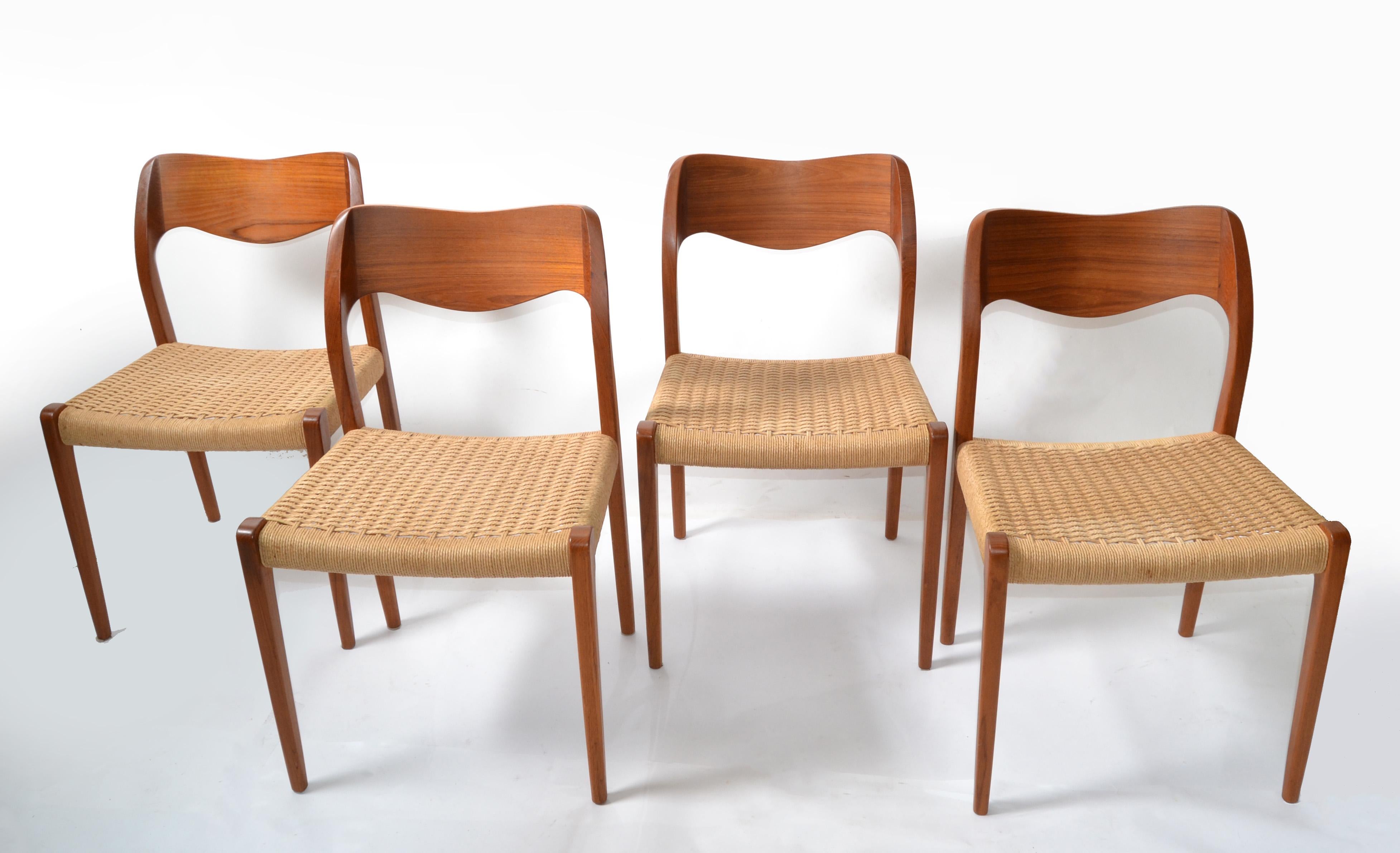 Set of 4 stylish Teak Scandinavian Modern Dining Chairs designed by Niels Otto Möller 1954, manufactured by J.L. Möller – Höjbjerg, Denmark. Model No. 71. 
Teakwood Frame upholstered with original handwoven Papercord Seat.
All chairs are marked