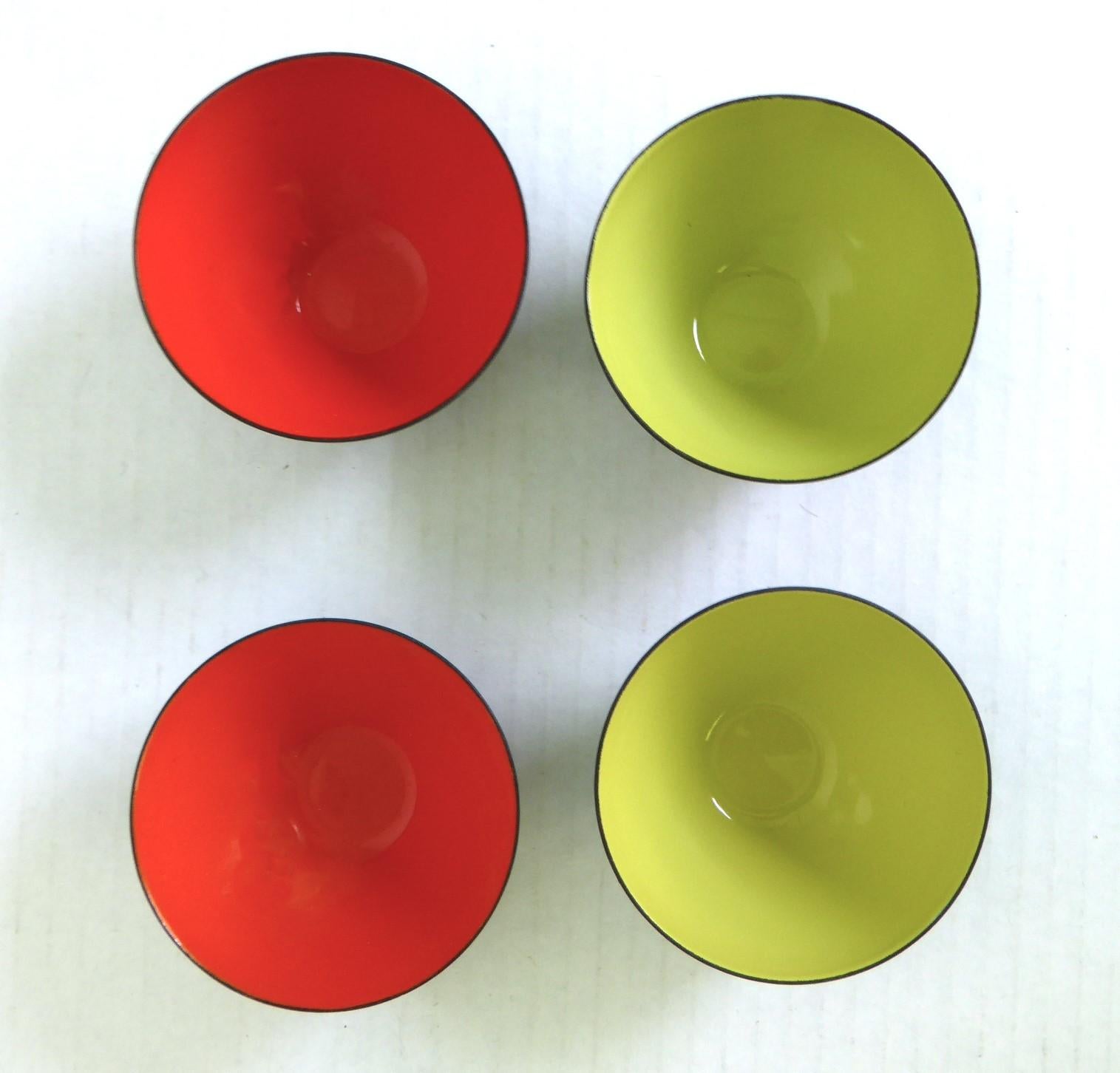 Herbert Krenchel designed hard to find 1950s vintage set of 4 Krenit smallest bowls, 1.50 inches height by 3.5 inches diameter, produced and marketed by Torben Orskov of Denmark.   Two with in tomato red and two with the lime green enamel. All in