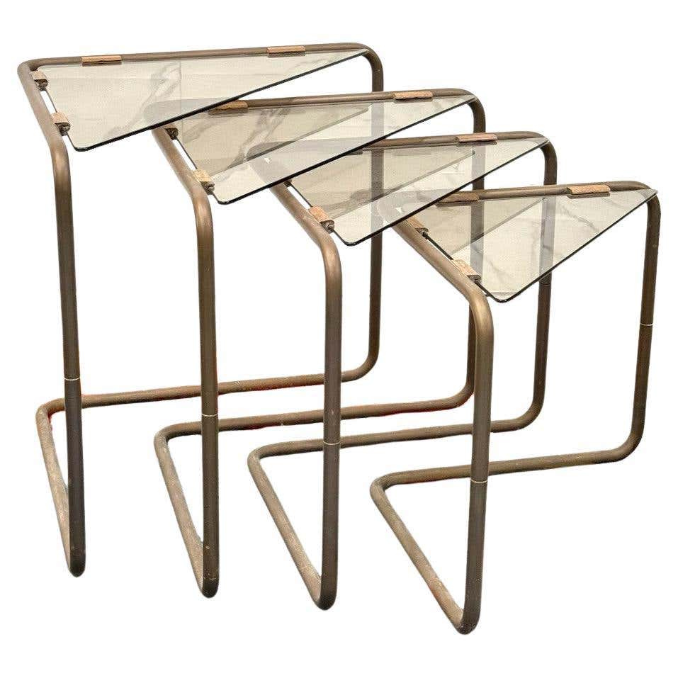 Set of 3 interlocking tables made of brass worked in the shape of ...