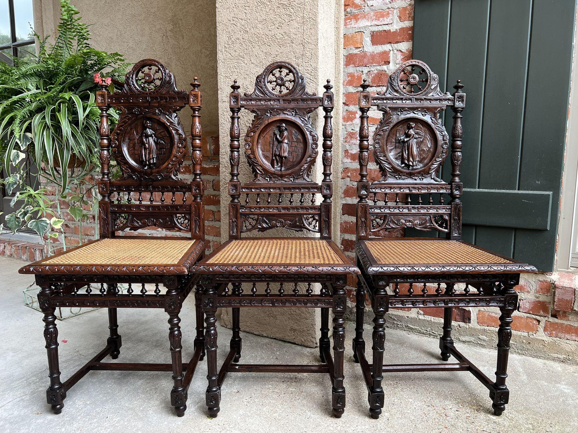Set 5 Antique French carved oak dining side chairs breton brittany w cane seat.
 
Direct from France, a lovely set of 5 antique French Breton dining chairs with classic Brittany style, perfect for a kitchen or dining room with the darker finish