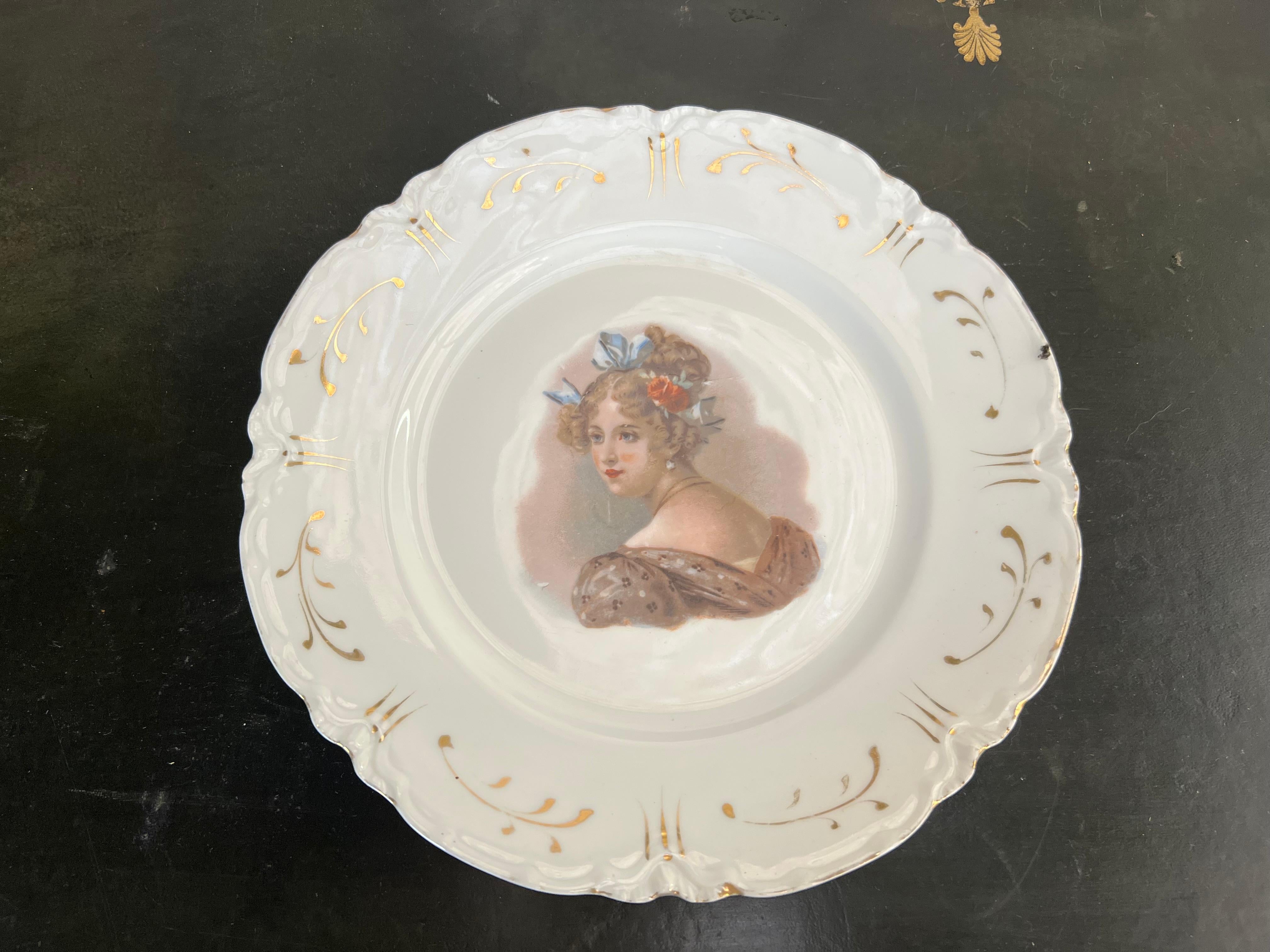 Set of five flat plates in Limoges porcelain from the Haviland manufacture. These collectible Haviland plates, dating back to the 19th century, showcase delicate porcelain paintings and gilding depicting portraits of young women, likely courtesans