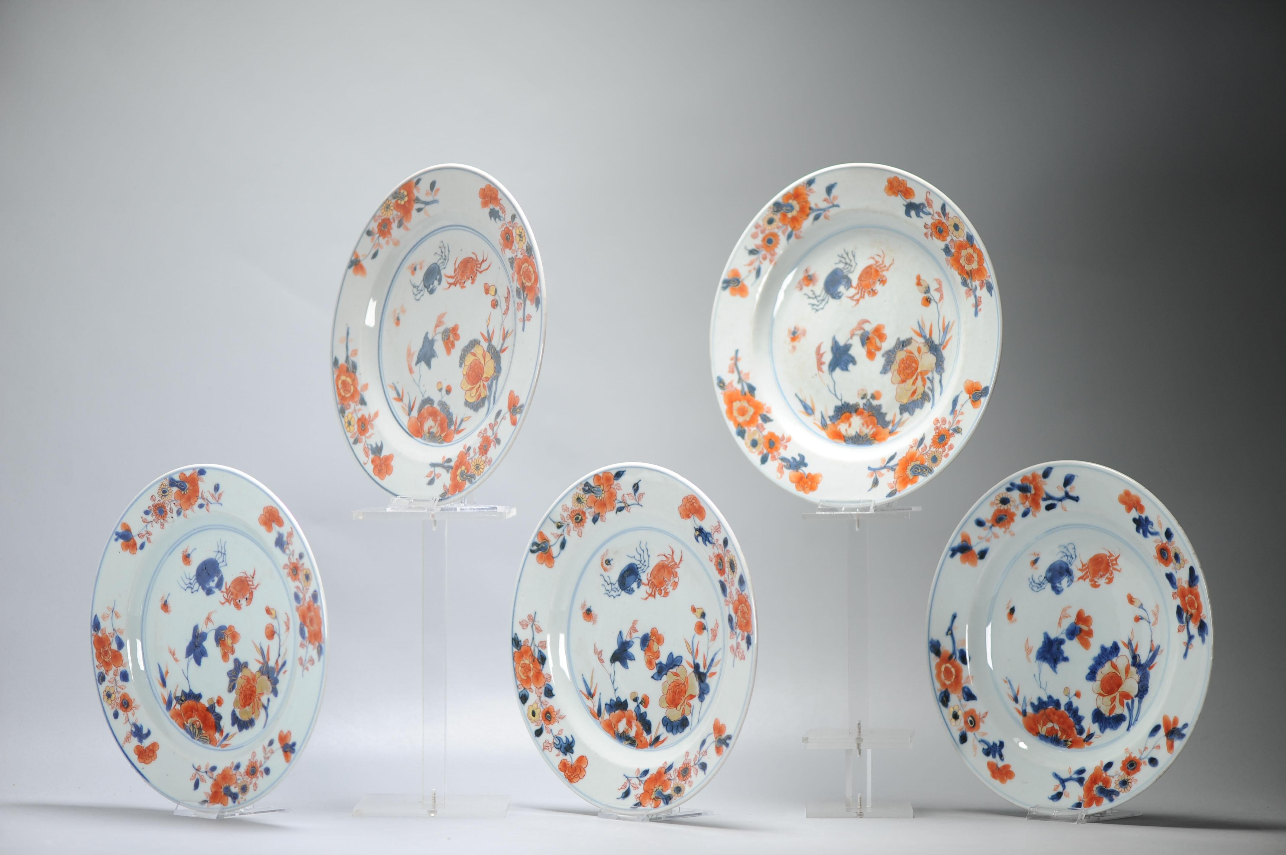 A very nicely decorated set of plates with underglaze blue and overglaze red and gold.

Pictured is a floral landscape scene, also with two CRABS in Blue and Red.

In Chinese culture, crabs are associated with prosperity and success, particularly
