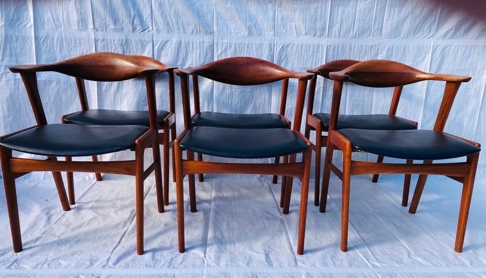 A beautiful set of 6 - 1960s Danish Erik Kirkegaard Model 49b solid teak dining chairs Manufactured by Hong Stolefabrik. 

The chairs are beautifully sculpted and well designed with comfortable backrests which curve into feature elbow supports. The