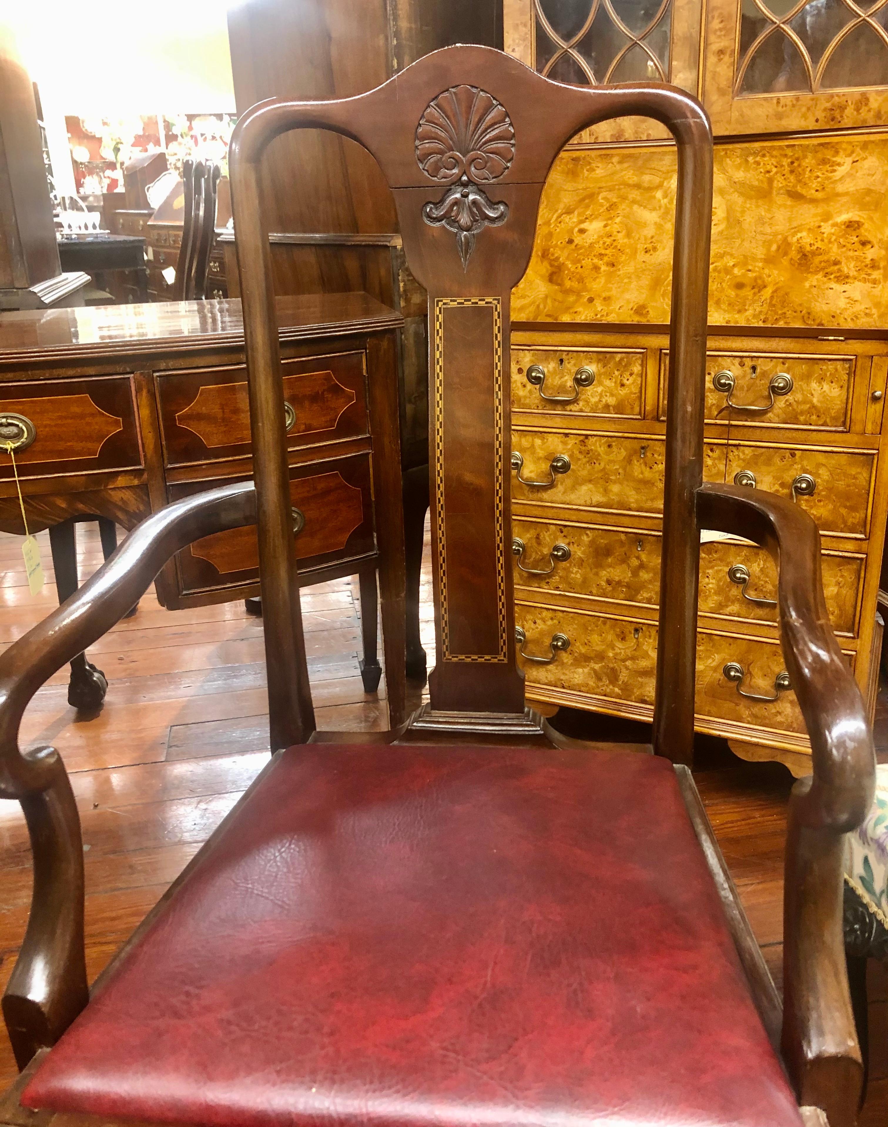 A very fine and unusual set of six (4 sides, 2 arms) antique English inlaid and hand carved solid mahogany Queen Anne style dining chairs with a lovely, comfortably curved, rectangular, flame mahogany back splat with checkered inlay. The crestrail