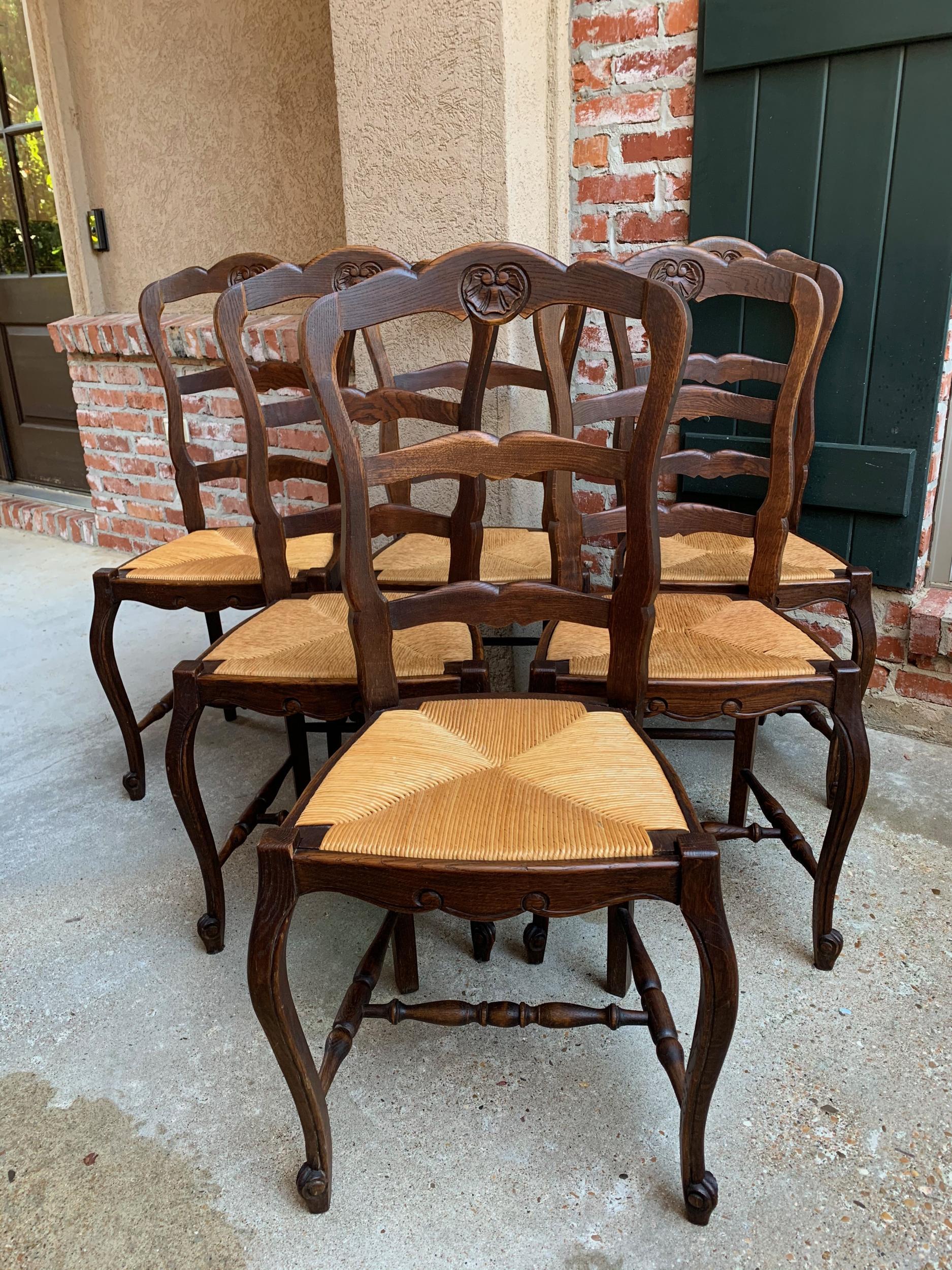 ~Direct from France~
~Lovely set of 6 antique French chairs, with classic French style… perfect for a kitchen or dining room with their original finish that compliments any decor!~
~Serpentine ladder backs with a pretty silhouette; rail has a