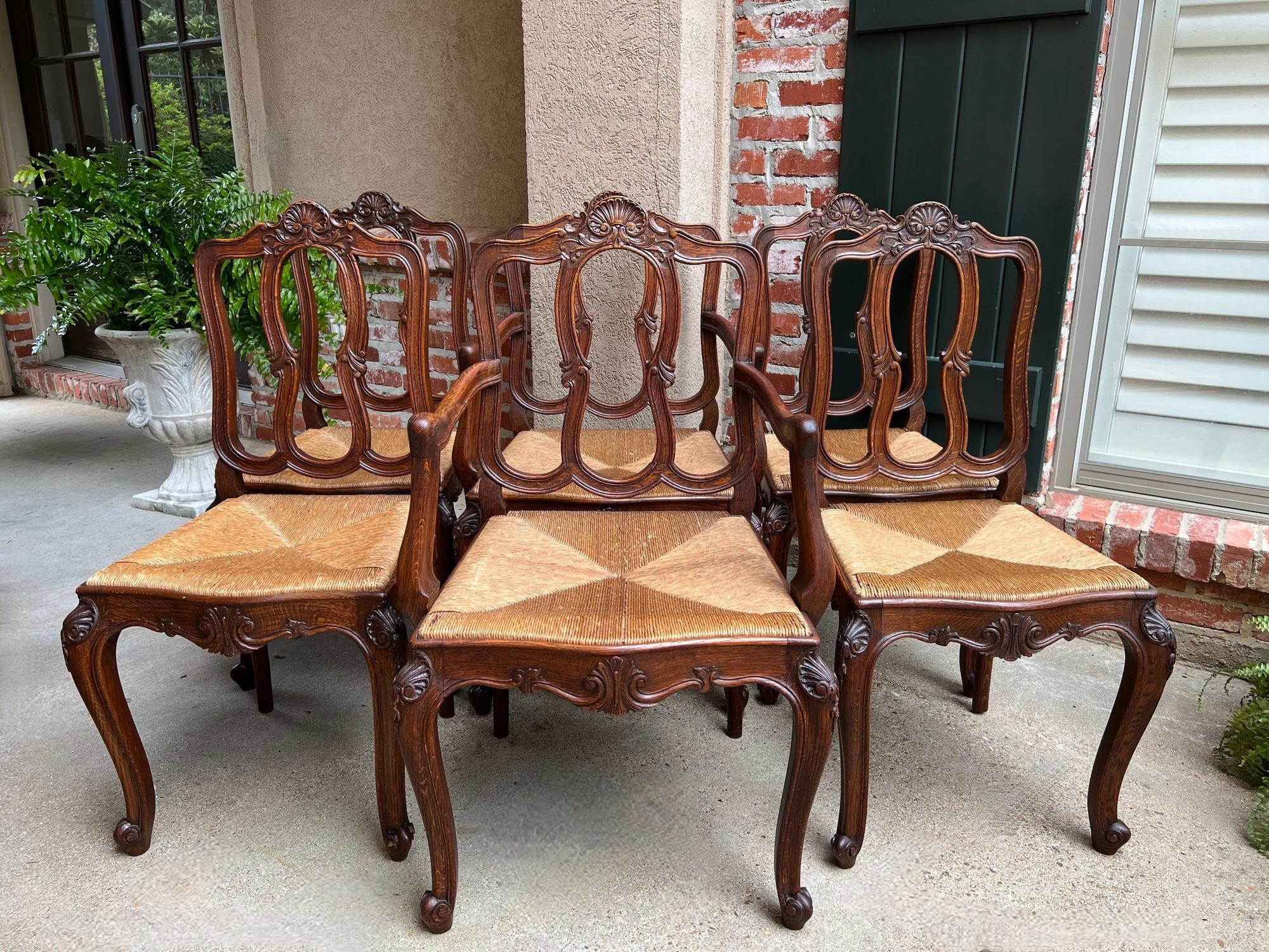 Set 6 Antique French Dining Chairs Carved Oak Rush Seat Louis XV Arm and Side Chairs.

Direct from France, a superb set of six antique French dining chairs, with classic French style…perfect for a kitchen OR dining room. Please note this matching