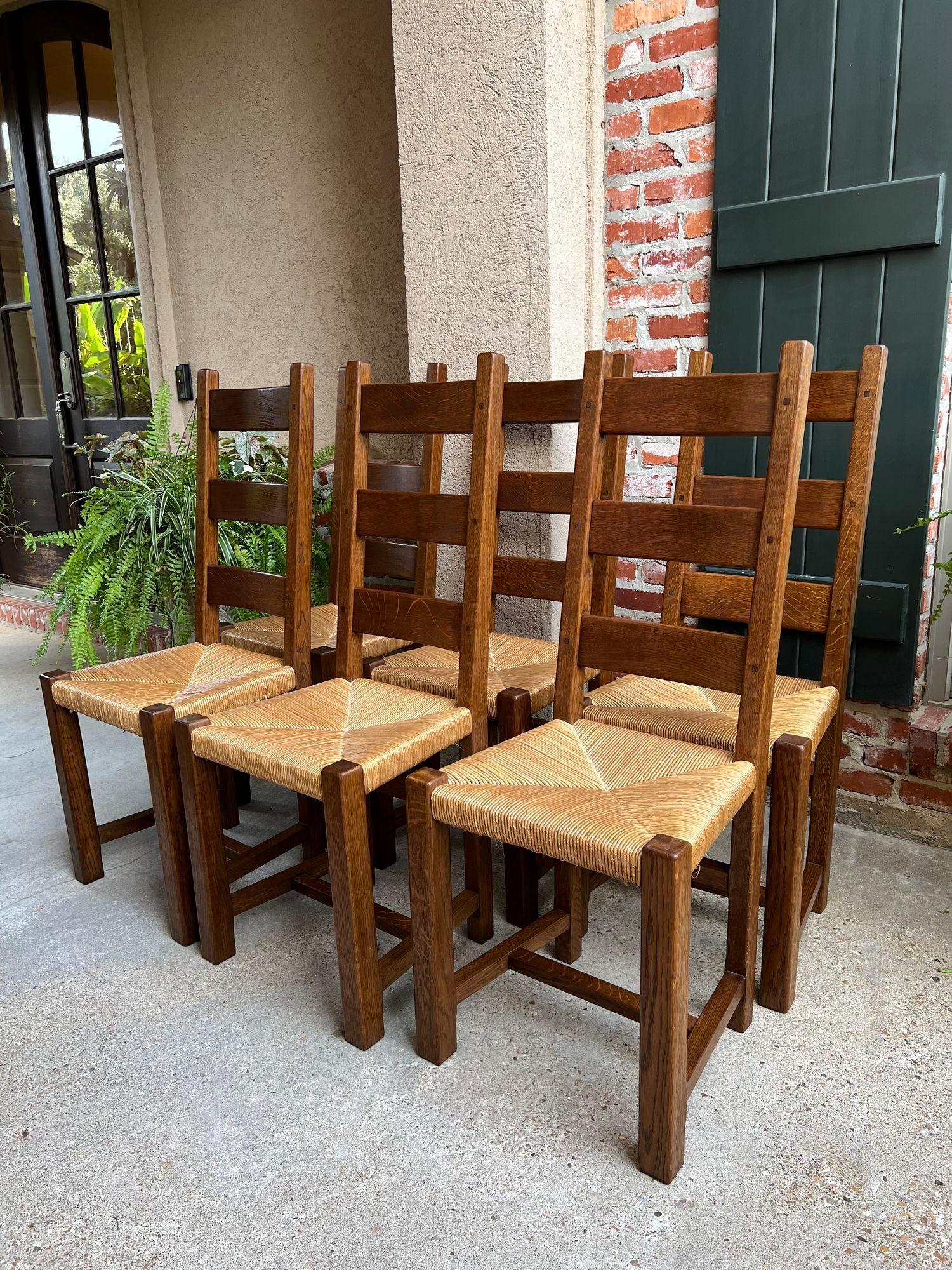 Set 6 Antique French Ladder Back Dining Chairs Carved Oak Rush Seat French Country.
Direct from France, a lovely set of 6 antique French chairs, perfect for either a dining room or kitchen with their classic French Country charm.
The chairs have a