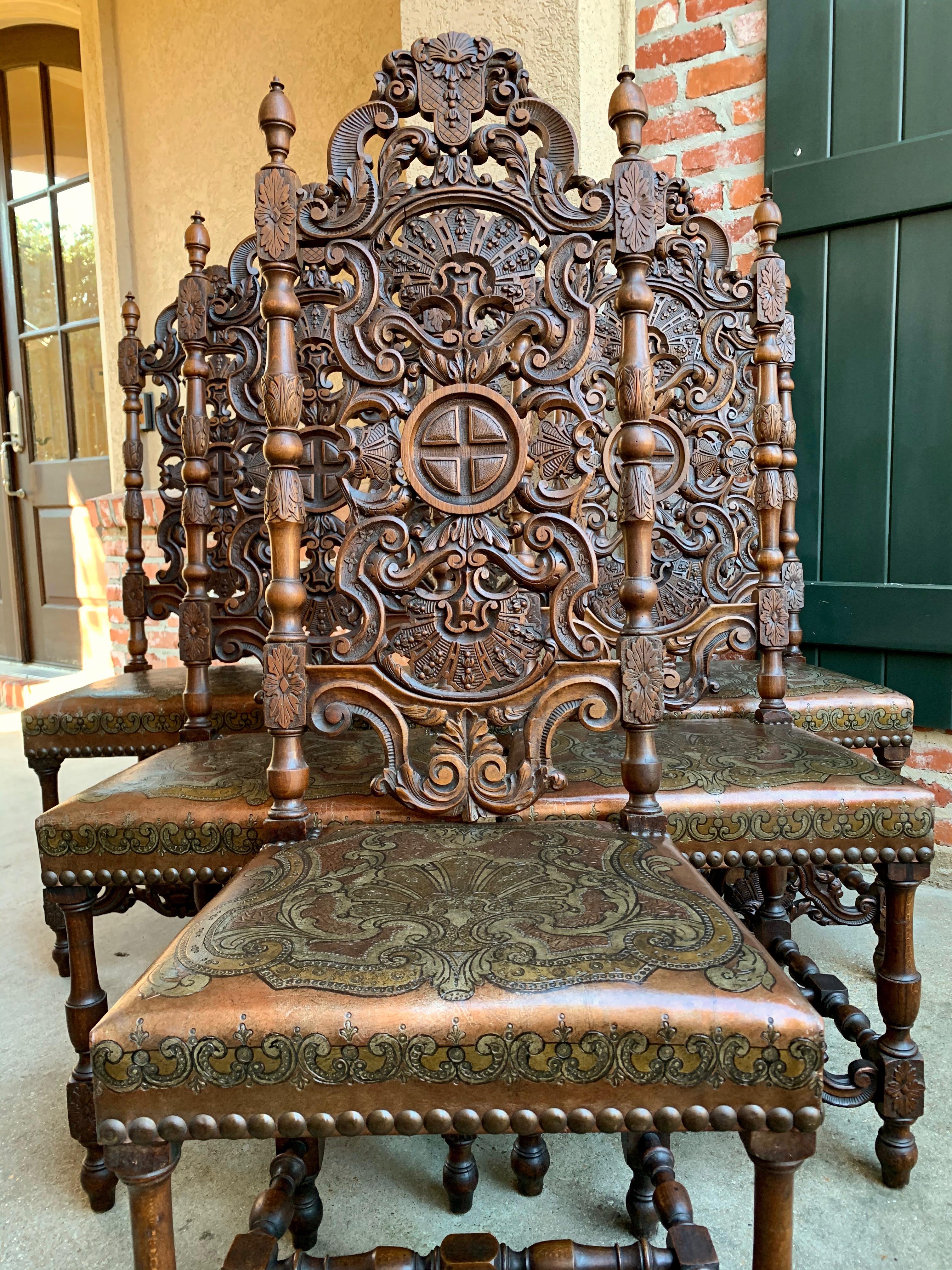 Direct from France, a majestically tall (over 4 ft.) set of 6 antique French dining chairs with outstanding open carved back splats and stunning embossed leather seats!
~Meticulous hand carved details on the back, with upper carved medallion
