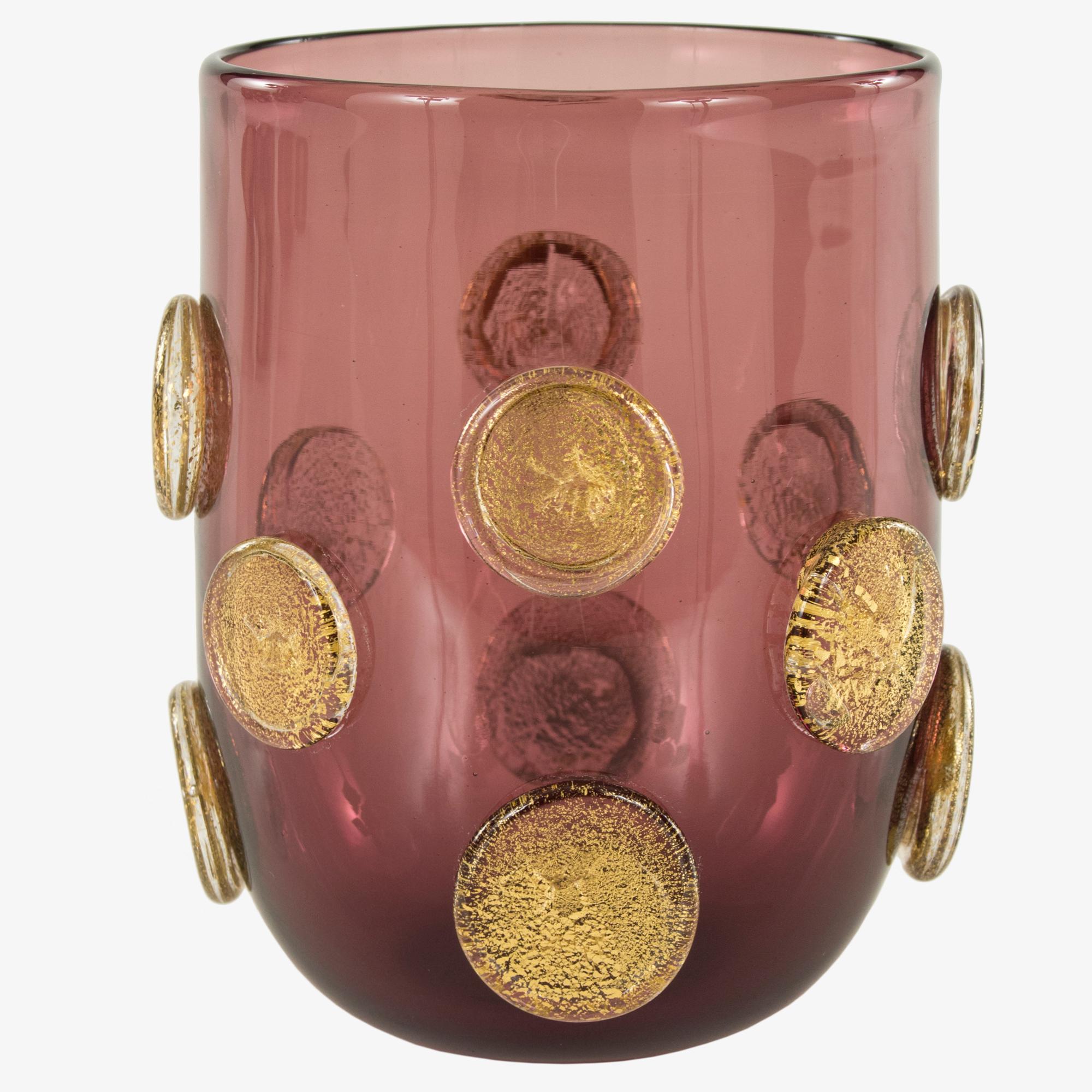 These artistic glasses are handmade by the master artisan in amethyst color with golden leaf round applications.
Every piece differs one from the other.

Precious pieces that can enrich every table.

The handcrafted soul of our lighting products is