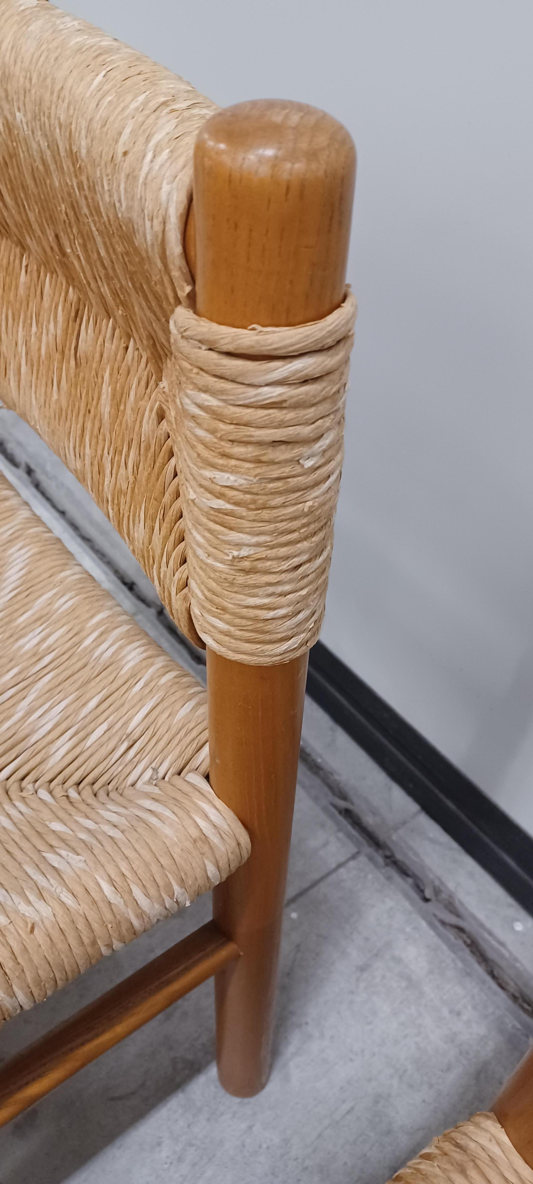 Set of 6 chairs designed by Charlotte Perriand and made by Robert Sentou   
Ash frame with original straw. 

