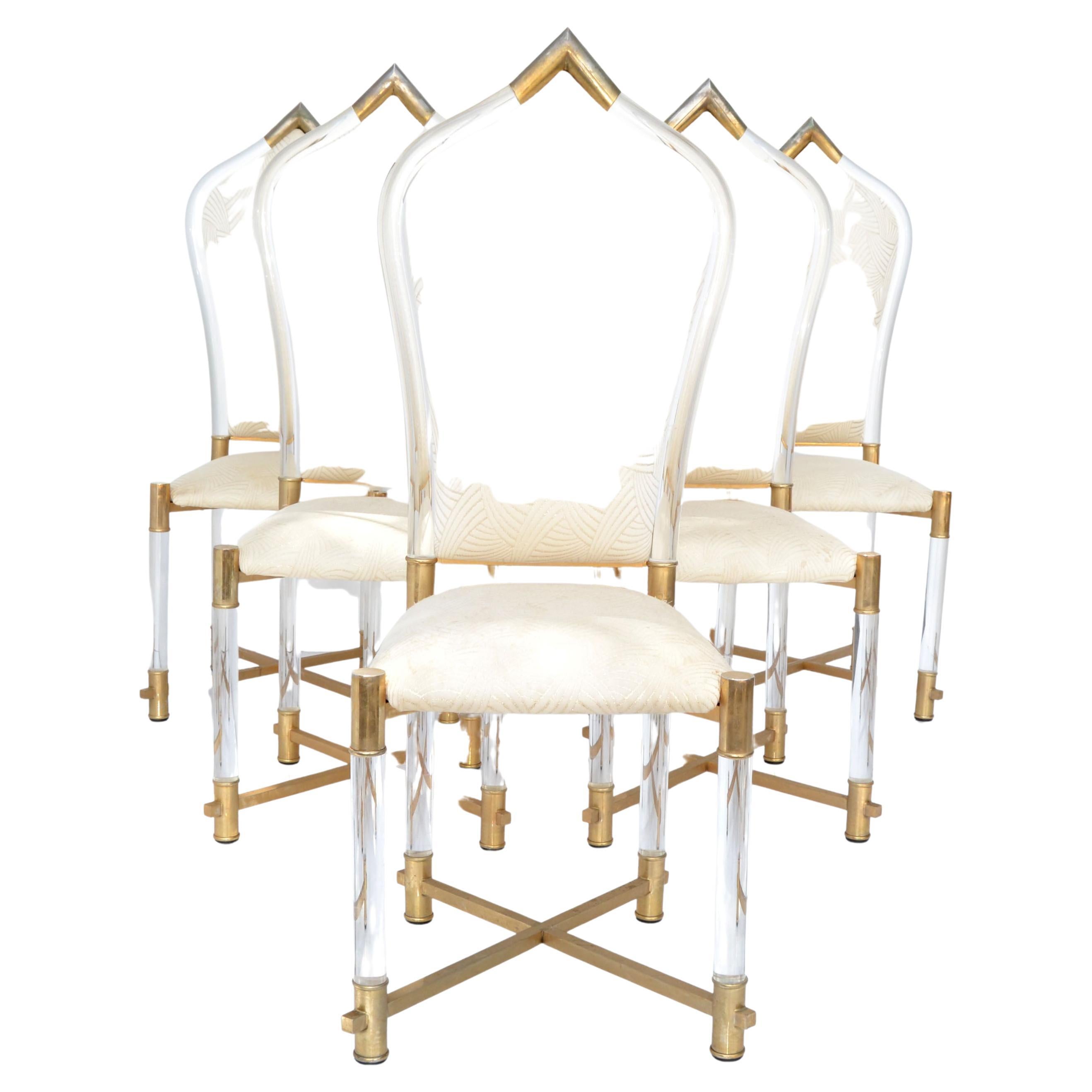 Superb set of 6 tubular lucite & brass dining chairs with a Gothic shaped high back rest, designed by Charles Hollis Jones in the 1970.
Very detailed with brass tip to the backrest and a brass cross stretchers base.
All original condition with