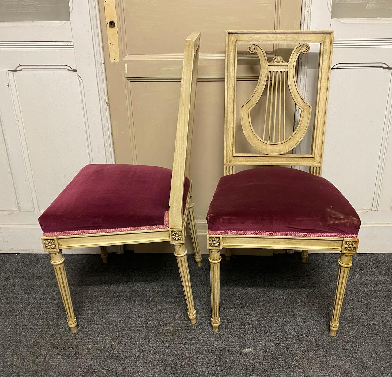 A nice set of painted French dining chairs with red velvet sprung seats. Nice harp back design. Chairs are strong and sturdy and in excellent original condition for the home.