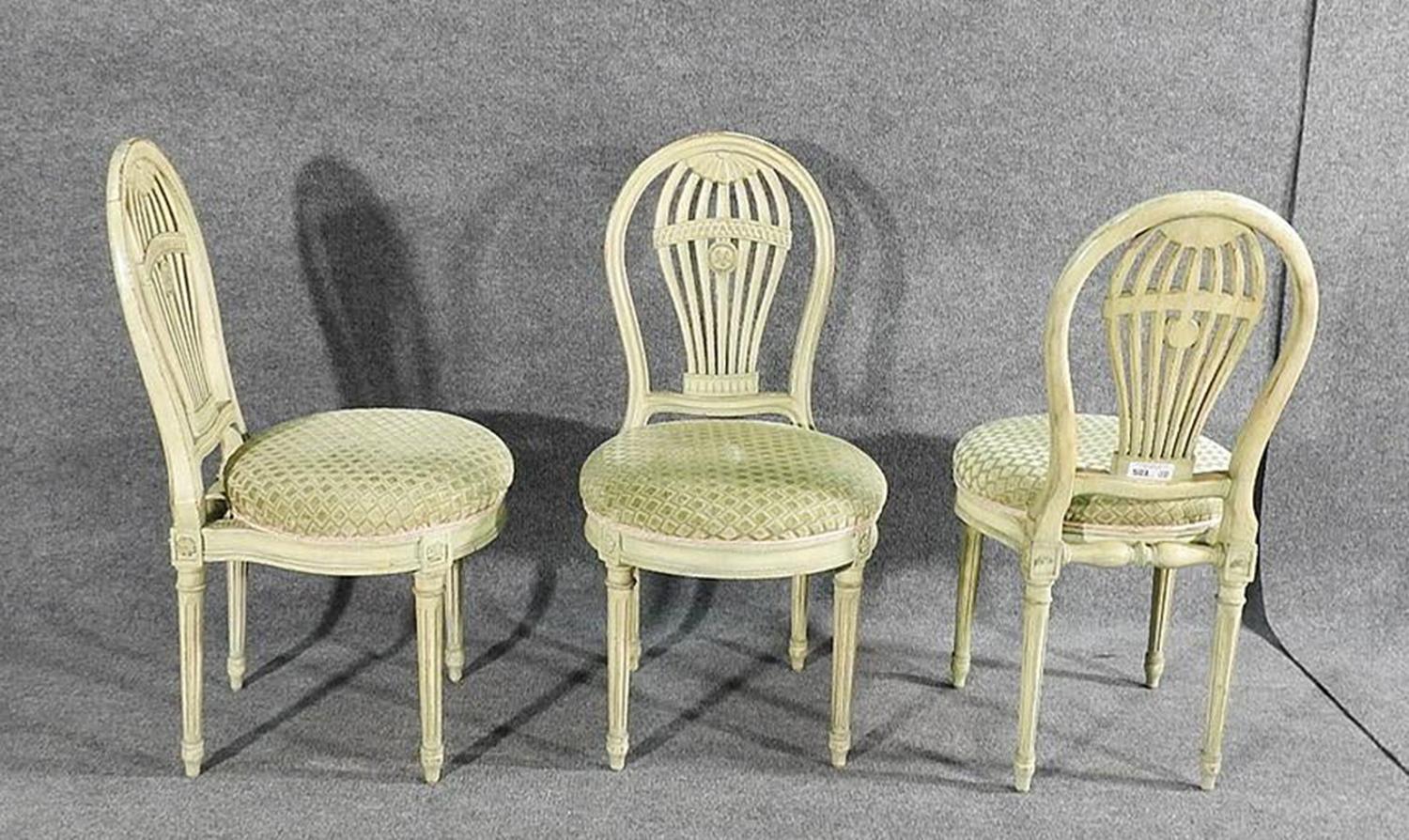 This is a fine set of Maison Jansen dining chairs in their original white painted finish and original and still very good upholstery, circa 1950s. The chairs are in good condition. The chairs measure 37
