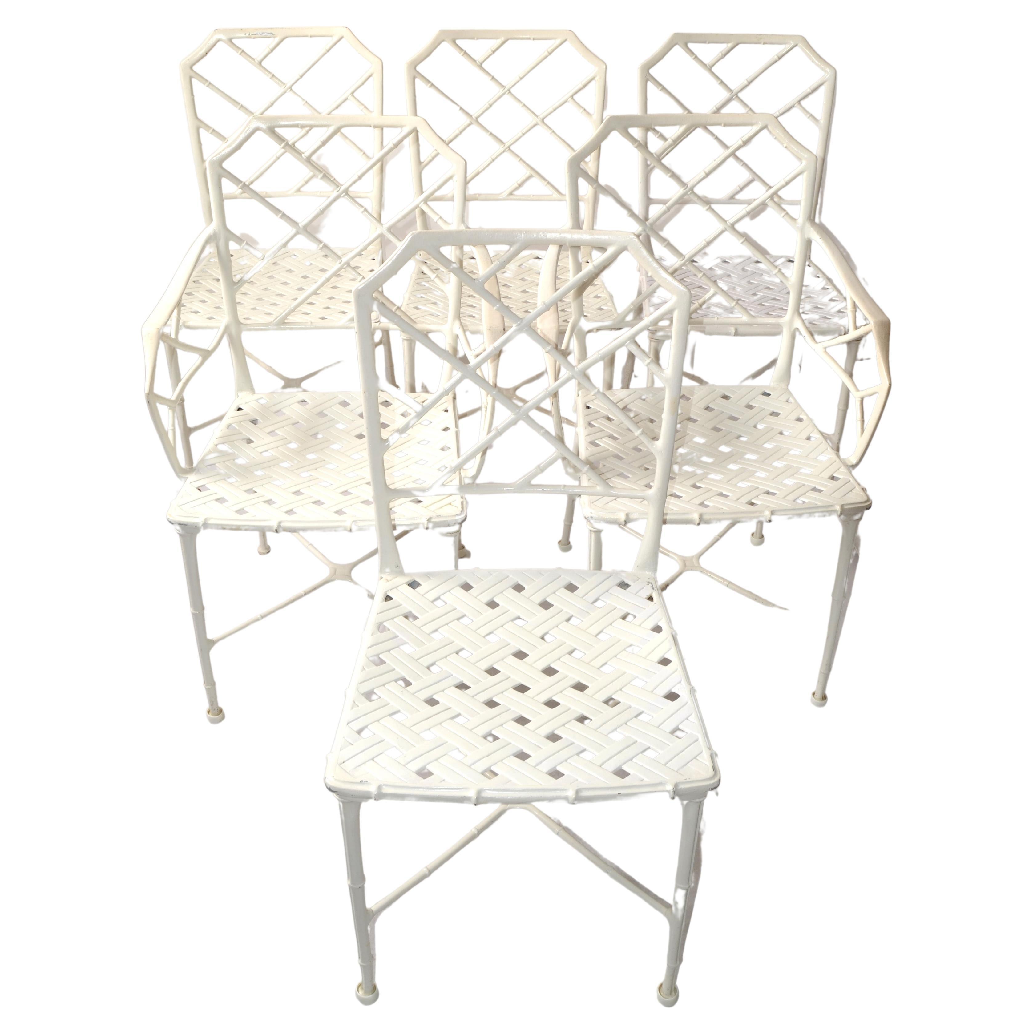 Set of 6 Calcutta Outdoor Patio Furniture designed by Hall Bradley in 1967 and manufactured by Brown Jordon, USA.
Featuring 4 Side Chairs and 2 Armchairs in cast Aluminum in distressed white finish with woven Lattice design in Chinese Chippendale