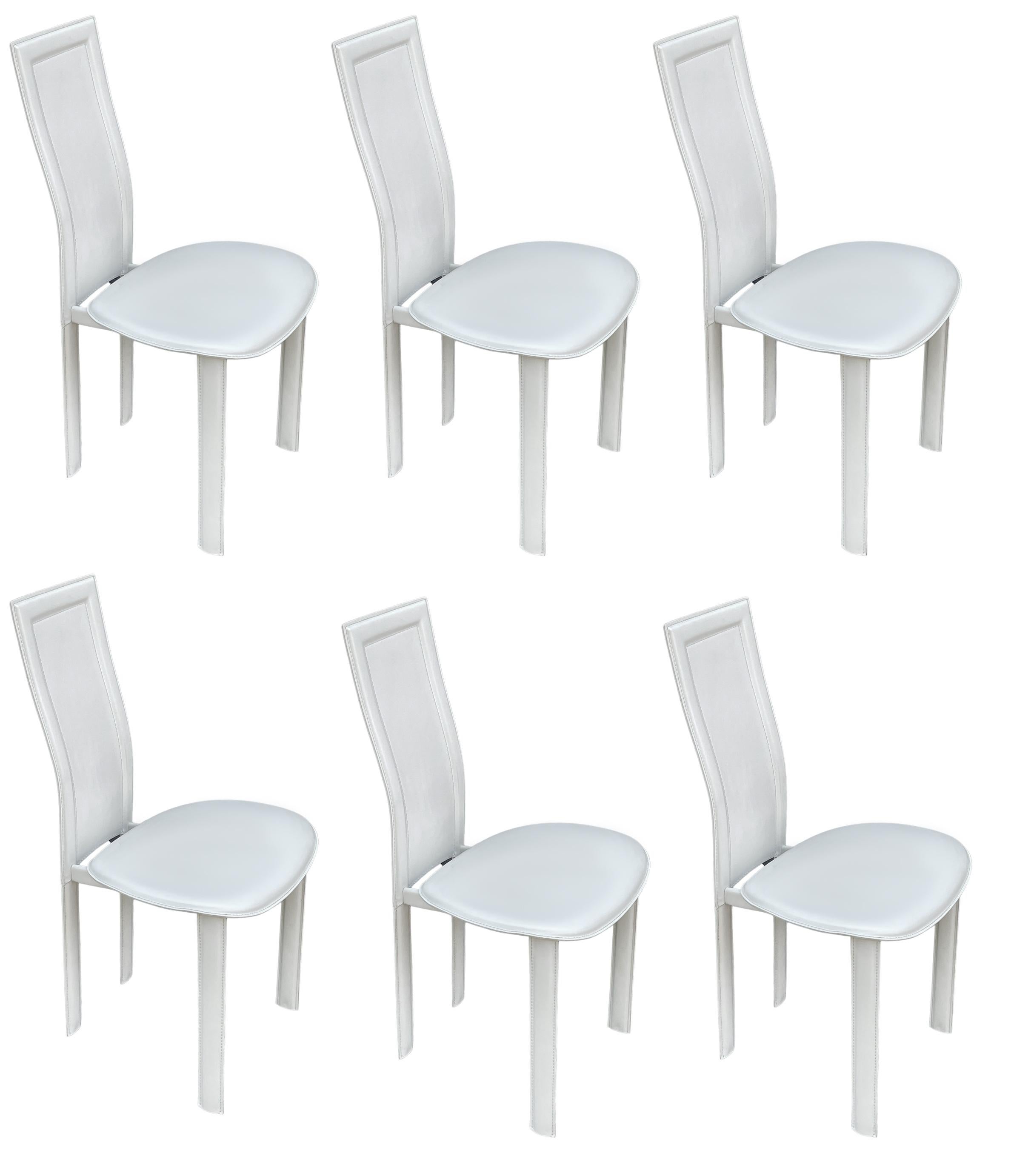 A sleek post modern set of six dining chairs by Cattelan Italia circa 1990's. They feature beautifully stitched white faux leather. Very clean and ready to use.