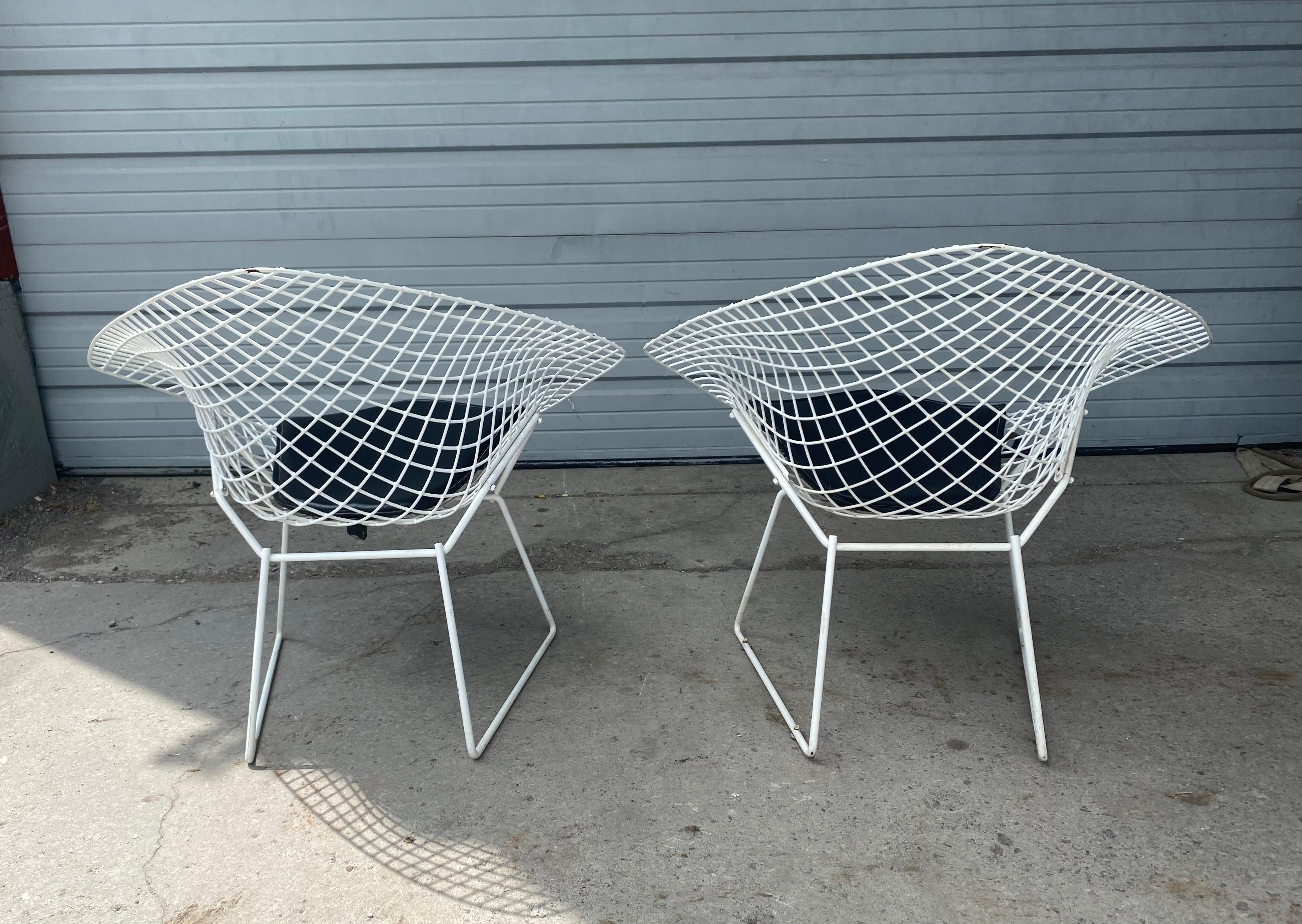 Classic set (6) side dining chairs designed by Harry Bertoia, manufactured by Knoll. These are coated for exterior use, but of course can be used inside as well, black seat pads are replacements. Chairs came from estate along with a large group of