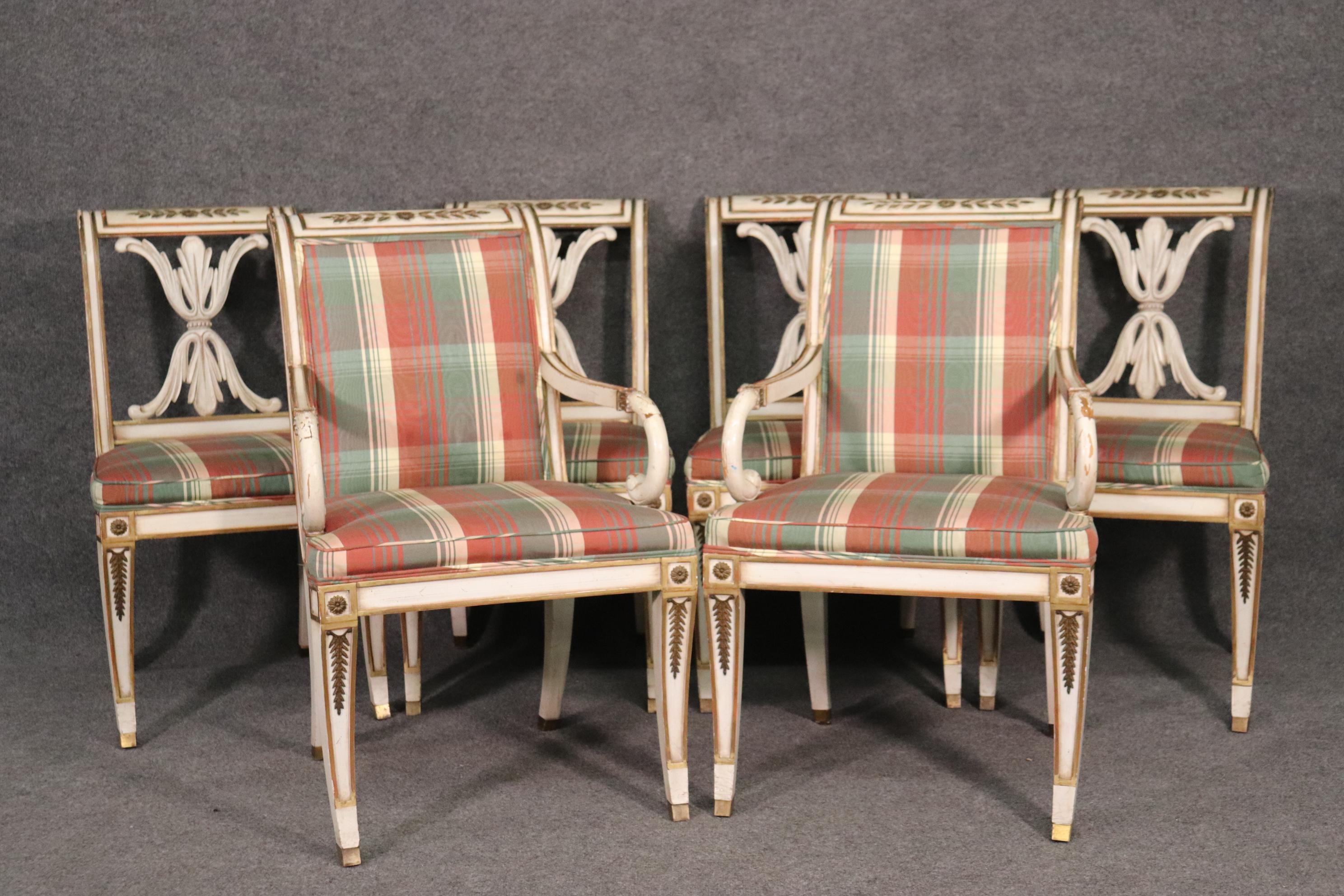 This is a nice set of antique white French Empire style chairs in original condition and having bronze mounts and nice looking upholstery. The chairs measure 36 tall x 22 wide x 25 deep x 19 inches for the seat height.