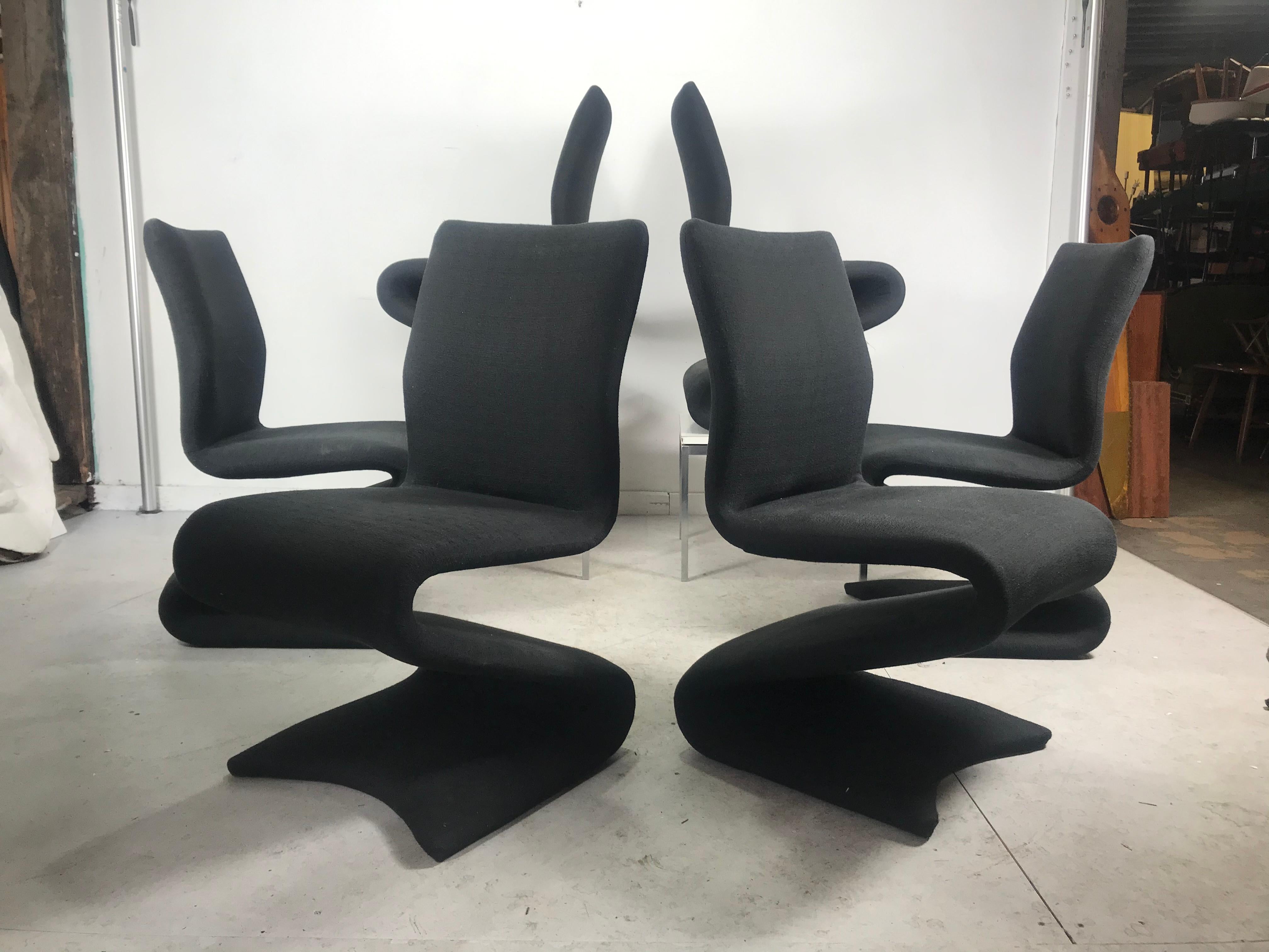 Stunning set of six dining chairs, Classic 1960s pop modernist design. Attributed to Vernor Panton, Model 275-s. Amazing quality, heavy. Dark charcoal grey fabric wrapped over S-shape tubular steel. Extremely comfortable, nice original condition.