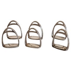 set 6 portatovaglioli d'argento  modellati come staffe