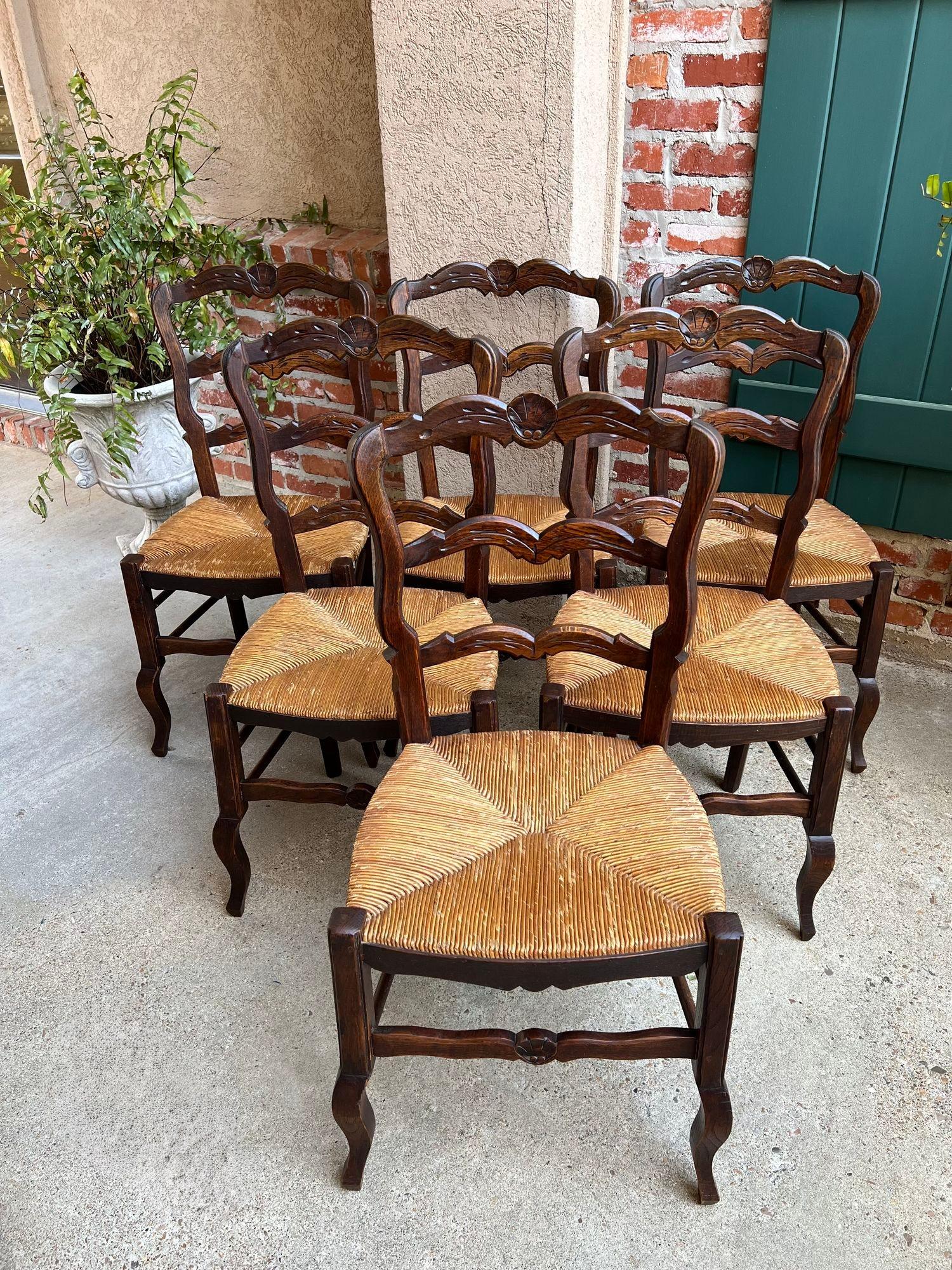 Set 6 Vintage French Dining Chair Rush Seat Louis XV Ladder Back Carved Oak.

Direct from France, a lovely set of 6 vintage French chairs with classic French style. Beveled, serpentine ladder backs with carved floral design to the upper crown.