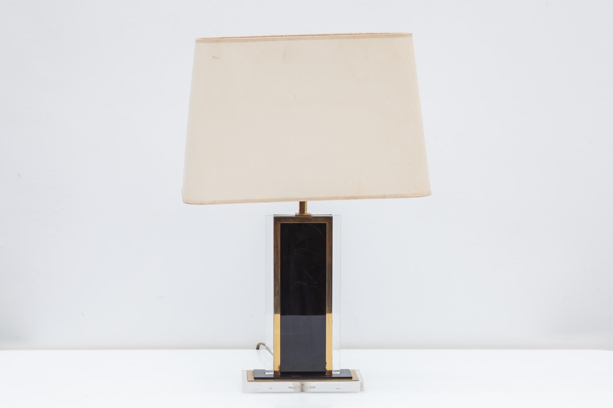 Vintage 1970s table lamps. Black and clear Lucite bases and brass accents with cream silk shades. The Lucite table lamps have the original shades with some watermarks, these are easy to replace to your own taste.
Bases: 18.5 W x 35 H x 10 D cm
