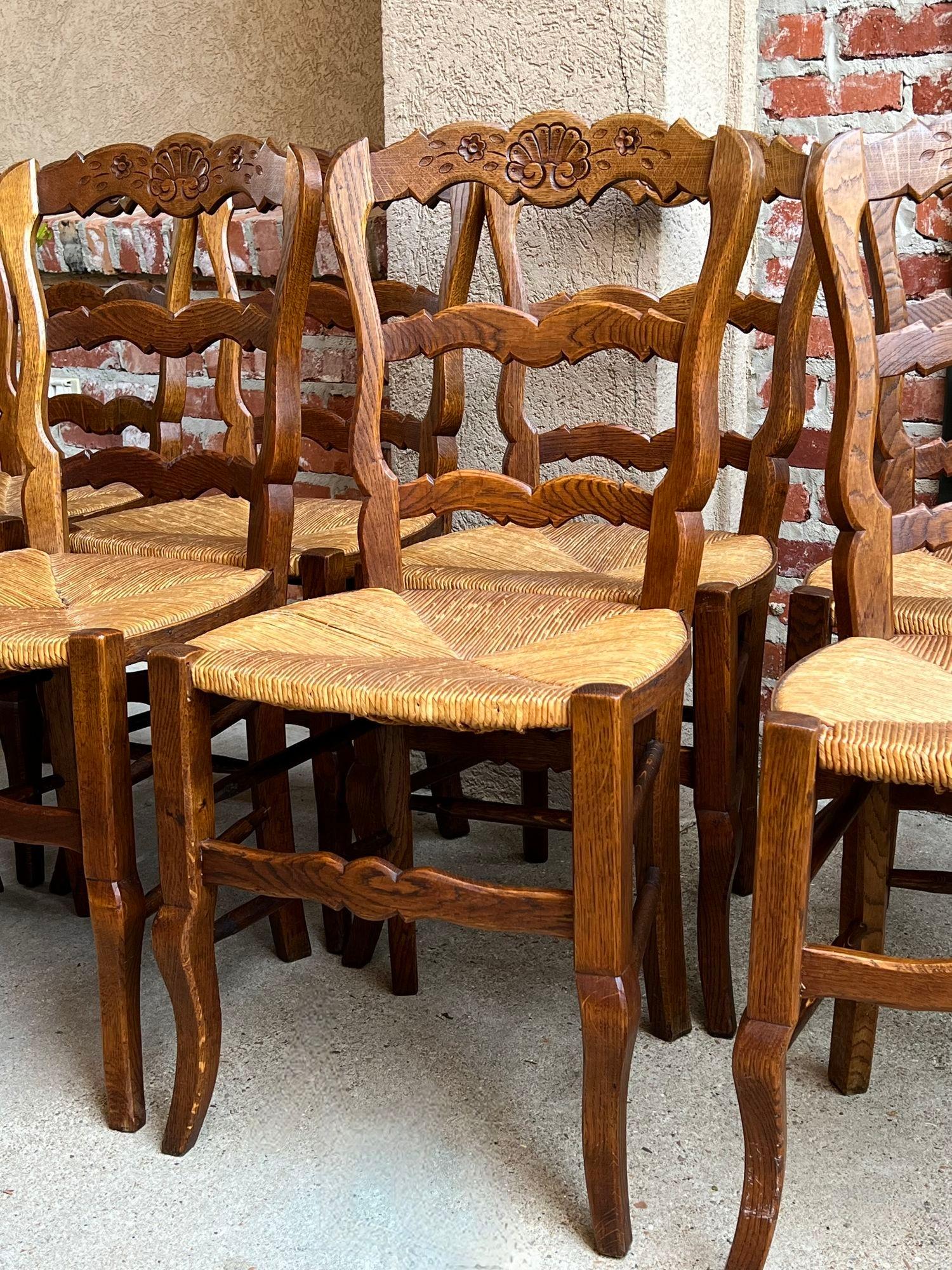 Set 8 Antique French Country Dining Chairs Carved Oak Rush Seat Ladder Back In Good Condition In Shreveport, LA