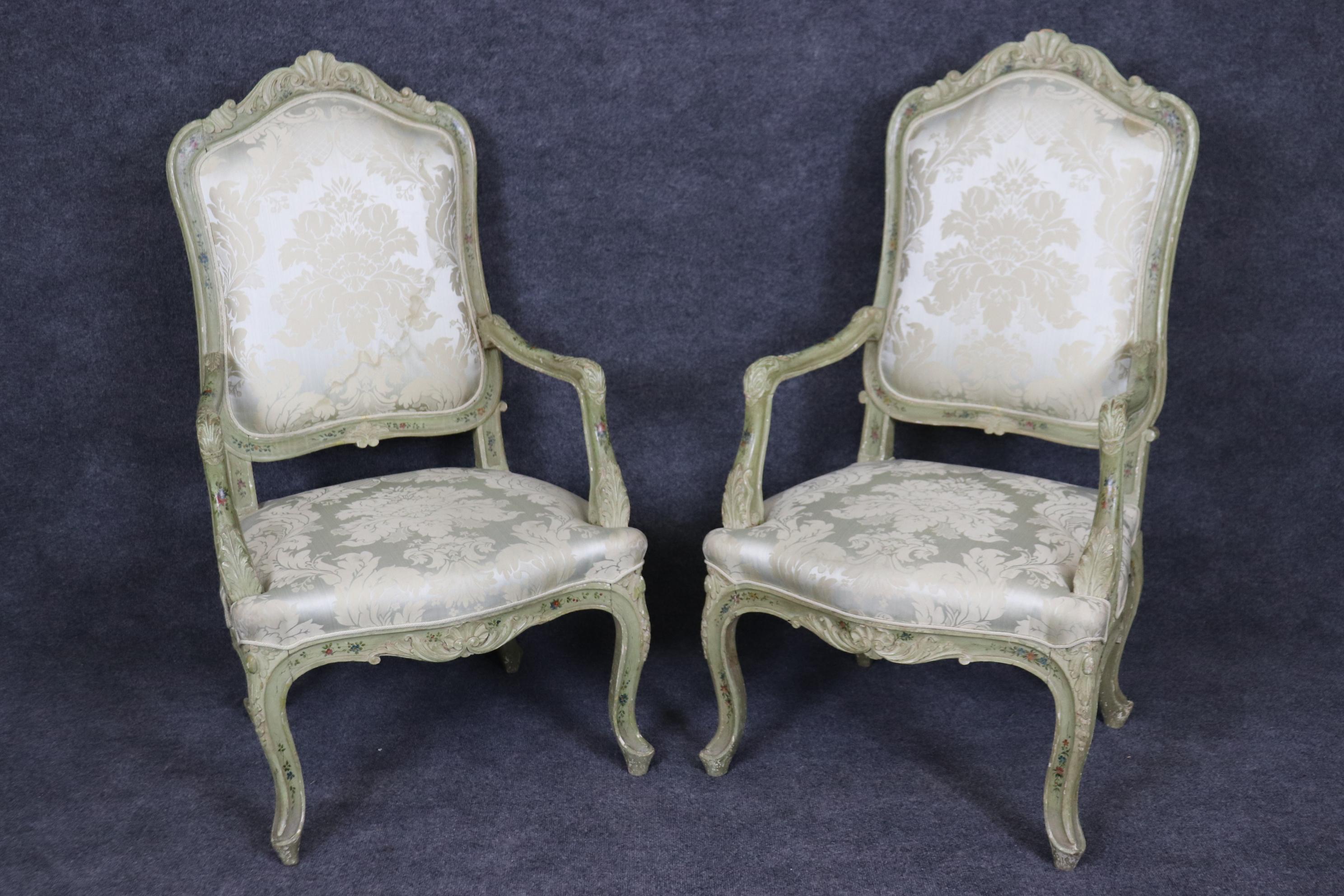 This is a gorgeous set of 8 Venetian paint decorated French Louis XV style chairs. The chairs were made in Italy in the French taste. The chairs have damages to their original upholstery and will need reupholstery however the frames are gorgeous and