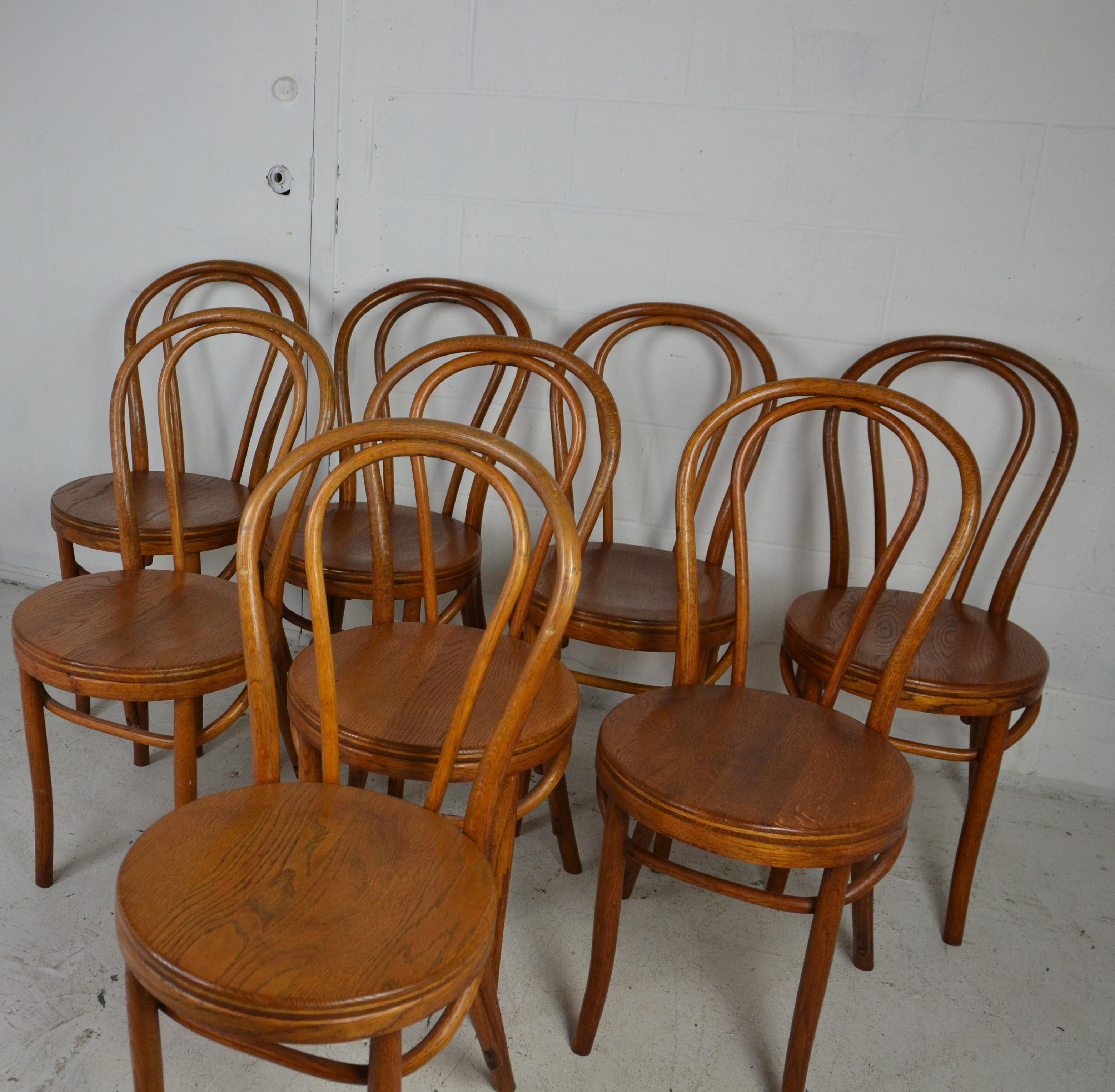A set of 8 bentwood chairs in oak. Usually found in beech-wood with plywood seats, these frames are completely made of oak and have solid oak seats.
