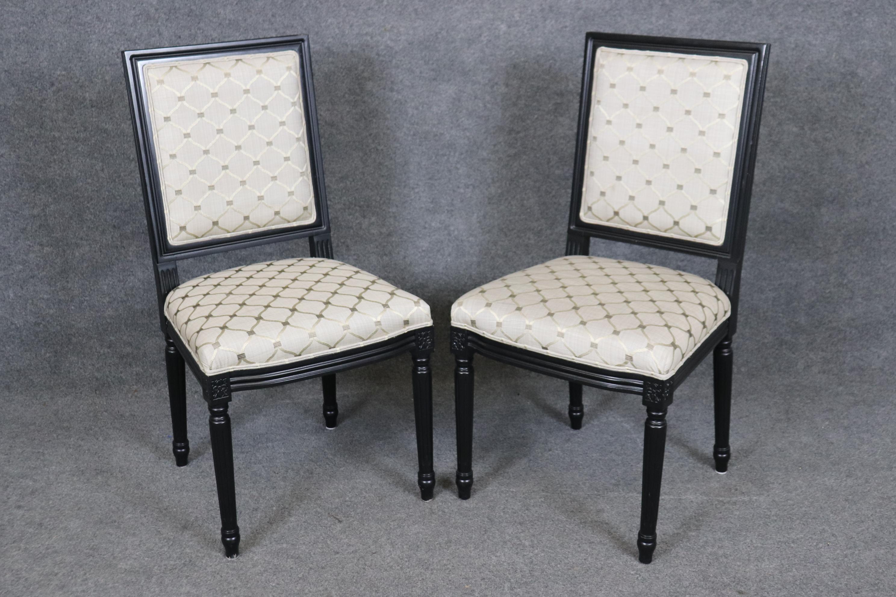 This is a chic set of 8 ebonized black lacquered dining chairs in the Directoire or Louis XVI style. The chairs are in good used condition and may show signs of age or minor stains or issues but they are used. The frames are gorgeous and being