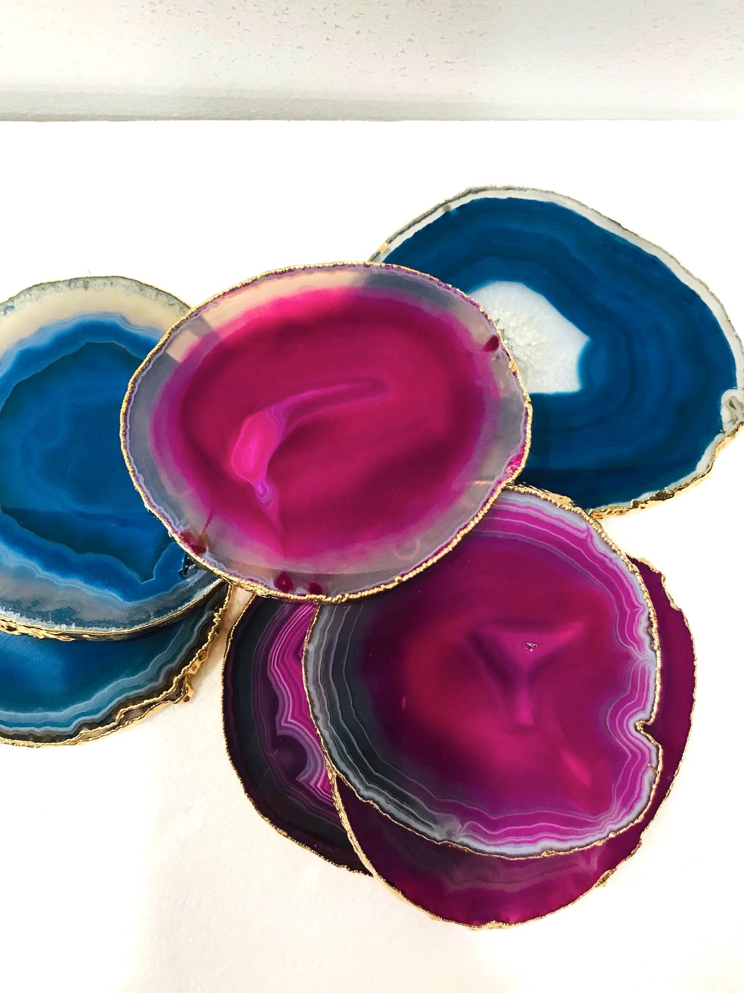 Set of eight organic modern agate and crystal coasters with 24-karat gold-plate finish. Set includes four fuschia and four turquoise coasters with polished fronts and natural edges. Make beautiful and unique accessories to any coffee table or
