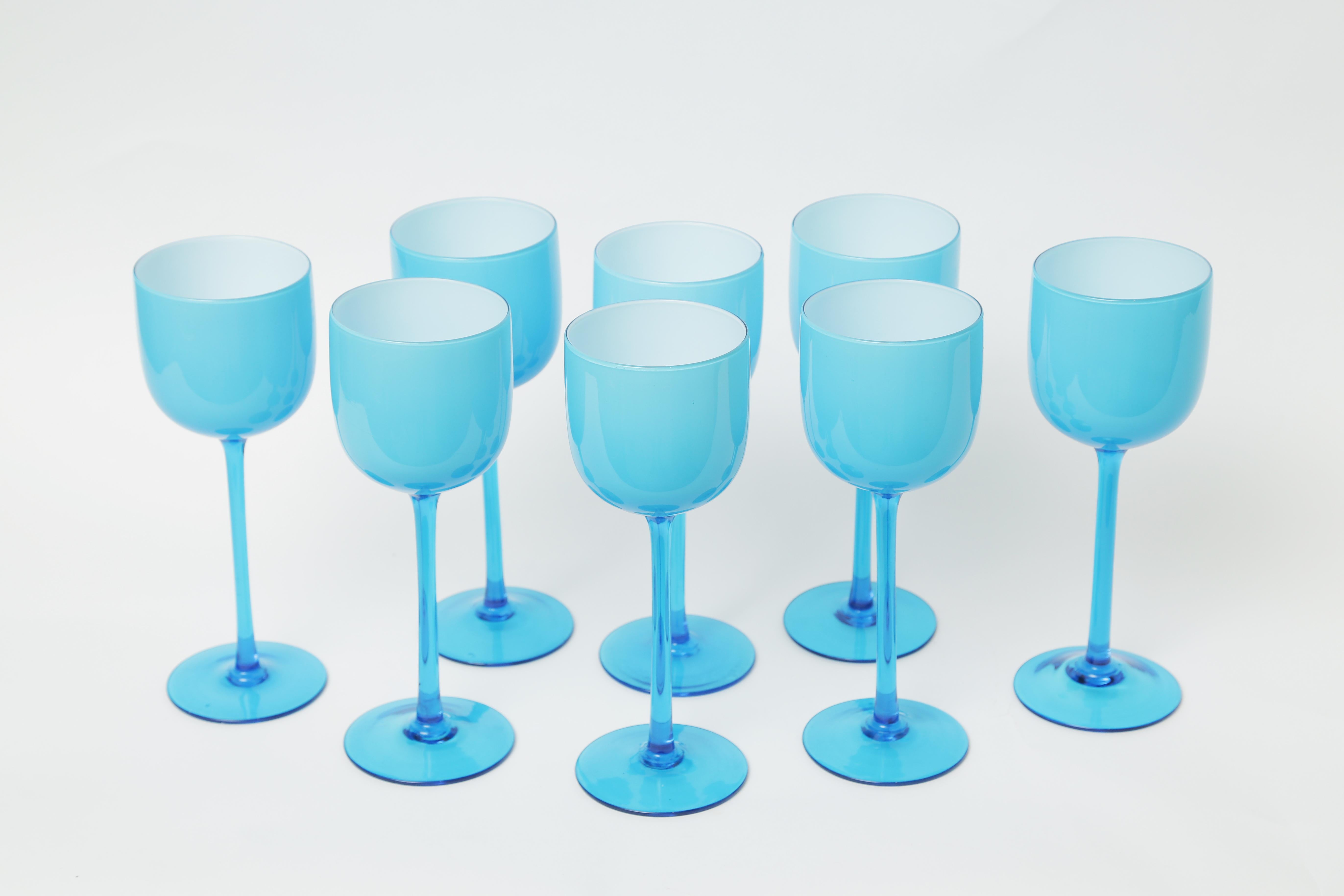 A great set of tall and beautifully colored goblets, circa 1960. These are well proportioned and retain a crisp white interior with all-over turquoise glass cased over and an ocean blue glass stem and base. Please note that they are oversized and