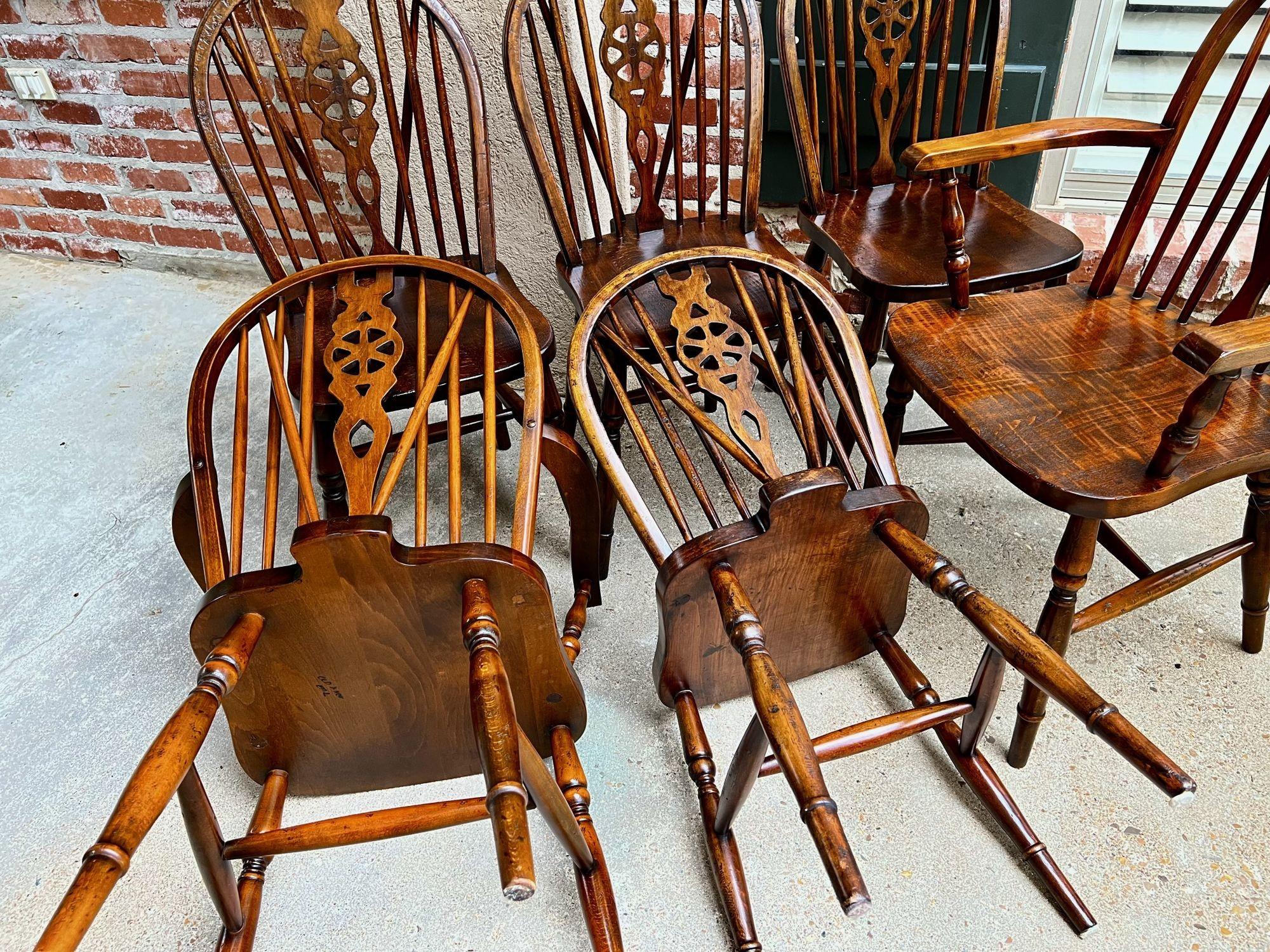Set 8 Vintage English dining chairs Windsor Wheelback Dark Oak w armchairs.
 
Direct from England, a complete set of EIGHT dining chairs, including two Armchairs and six side chairs!
Classic and traditional, Windsor style with the wheelback