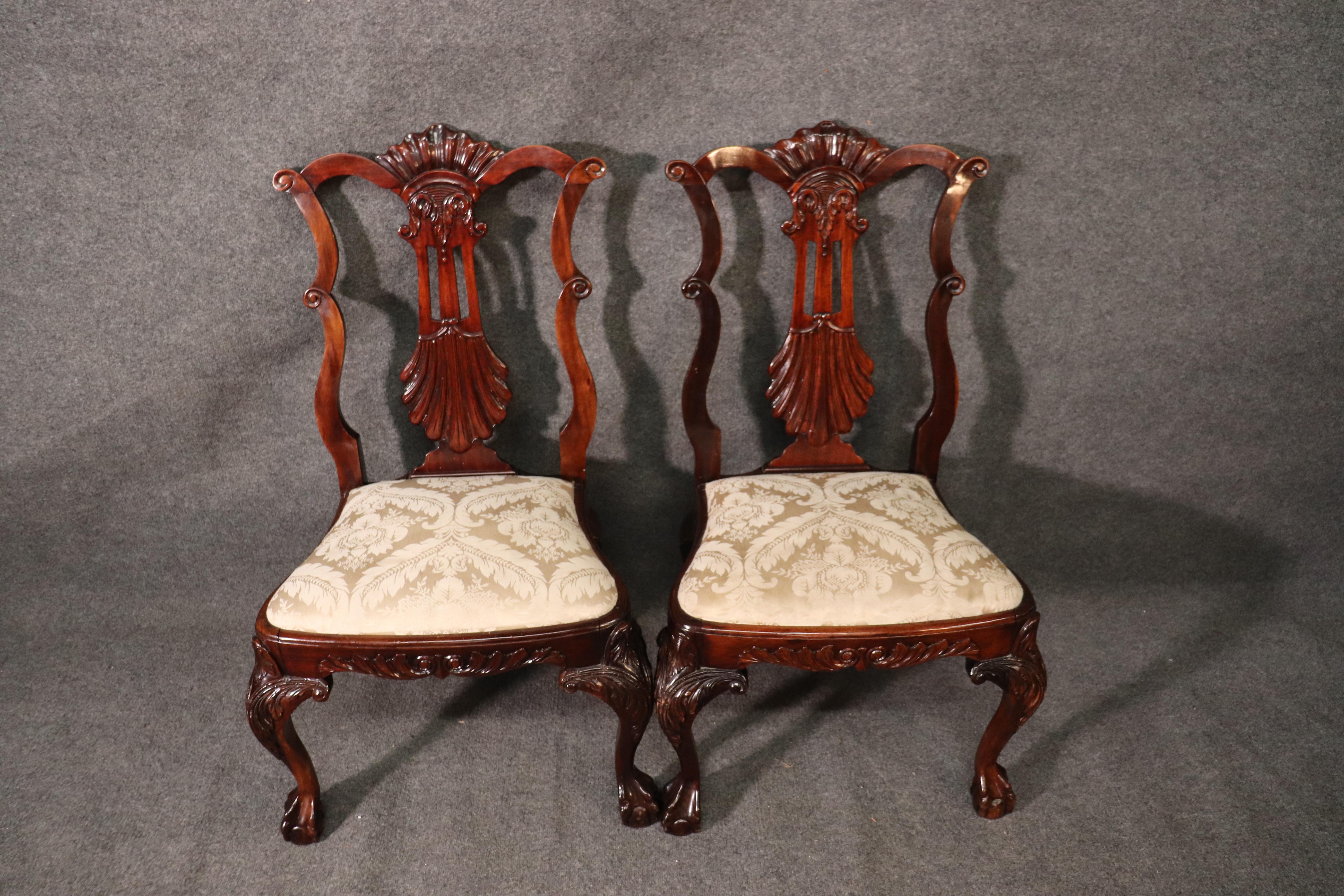 These gorgeous chairs feature a unique design that we have never seen before. The chairs are made of solid mahogany and mortice and Tenon construction with pinned joints. The chairs date to the early 1900s and just beautiful. The chairs measure: 41