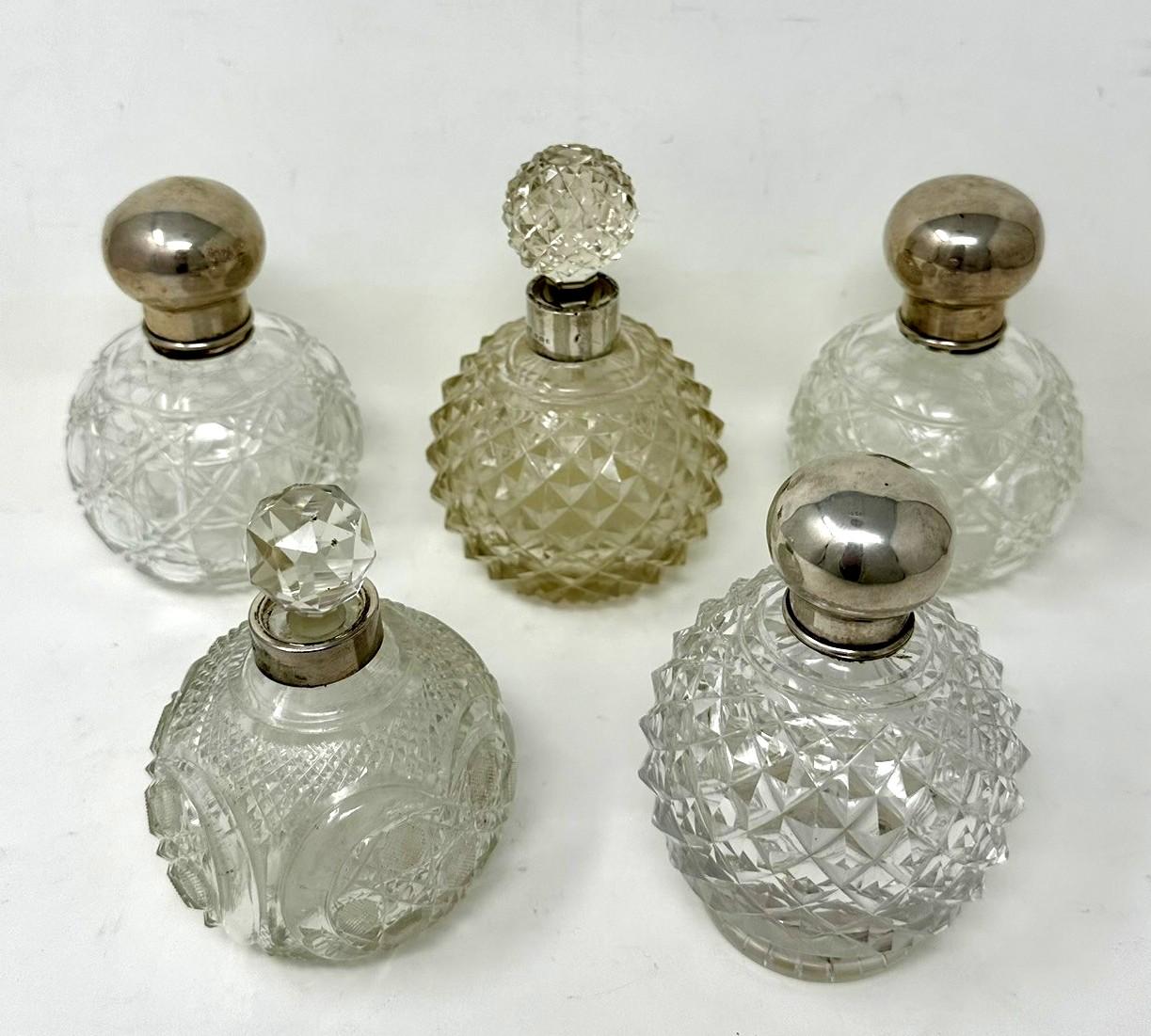 An Exceptionally Fine Quality Collection of English Edwardian deep hand cut full led Crystal Ladies Scent Bottles, all complete with their original Sterling Silver tops and stoppers of standard sizes outstanding quality, 

Makers Marks:  
Alexandra