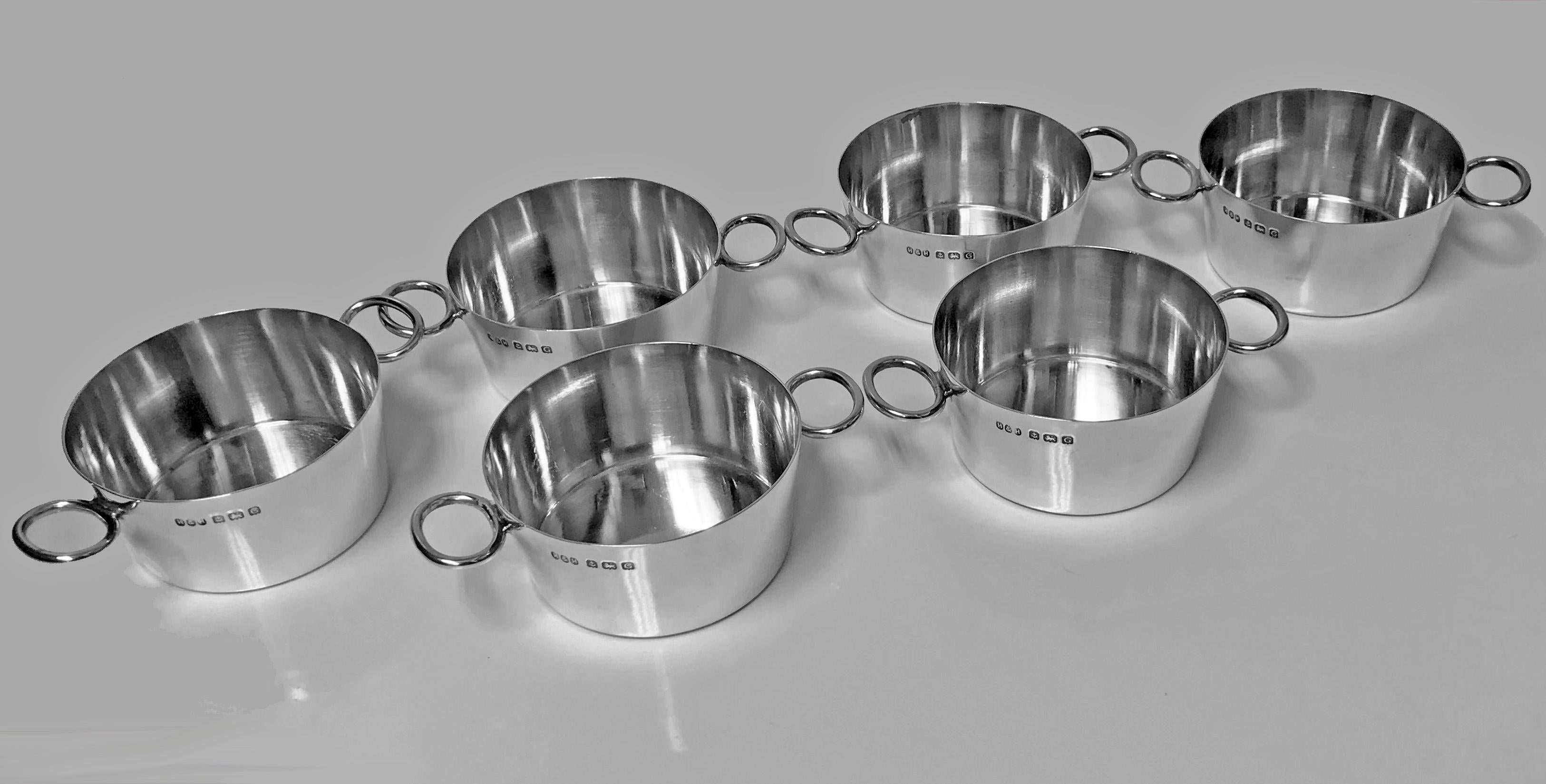 Rare set of Art Deco Hukin and Heath solid sterling silver Ramekin dishes, Birmingham 1931 Hukin and Heath. Each of simple very slightly tapered form with open oval side handles. Each fully hallmarked. Measures: Height 1.50 inches, diameter 3.0