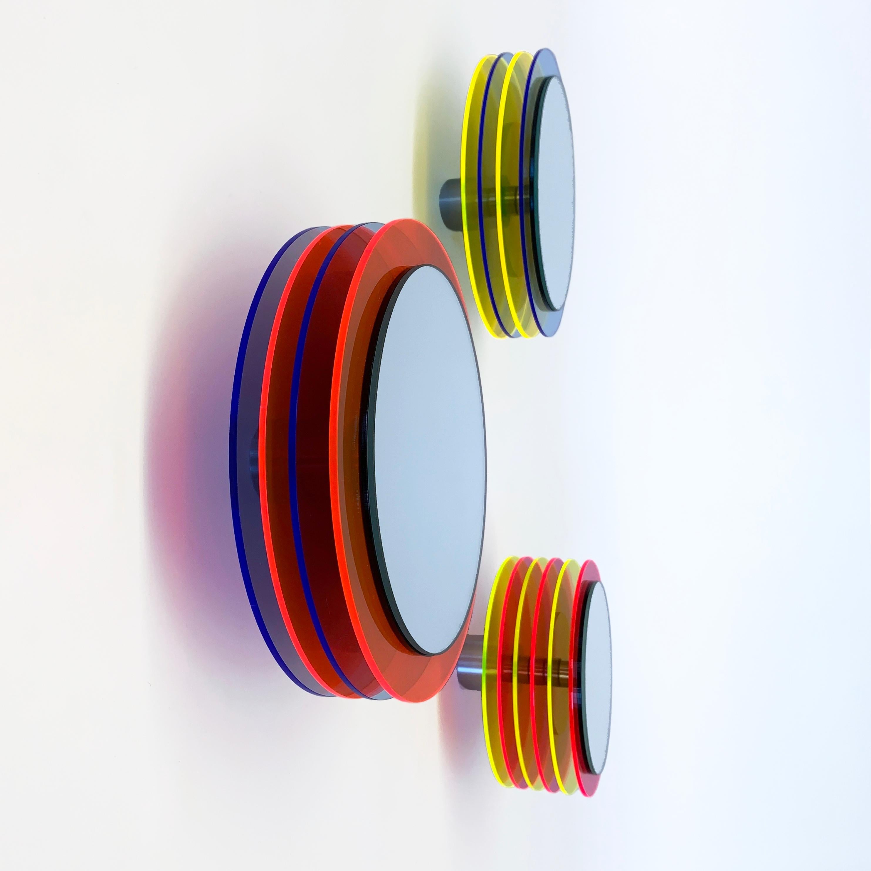 Reduced forms create fascinating wall sculptures, a play with translucently, ambient light and color.

The mirror objects float in front of the wall and create fascinating sculptures full of positive energy through color, light and translucency and