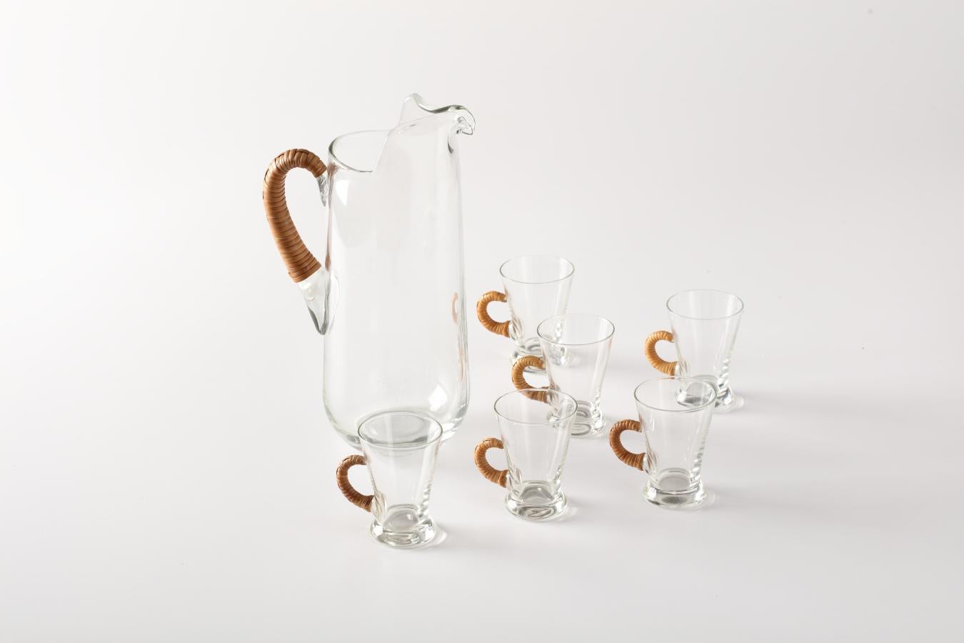 Carl Aubock Style Pitcher and Glasses. Crystal Drink Pitcher. Six Handled Glasses Cups. Rattan wrapped handles, Denmark 1960s