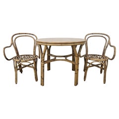 Set with coffee table and two vintage wicker chairs for outdoor 1970s