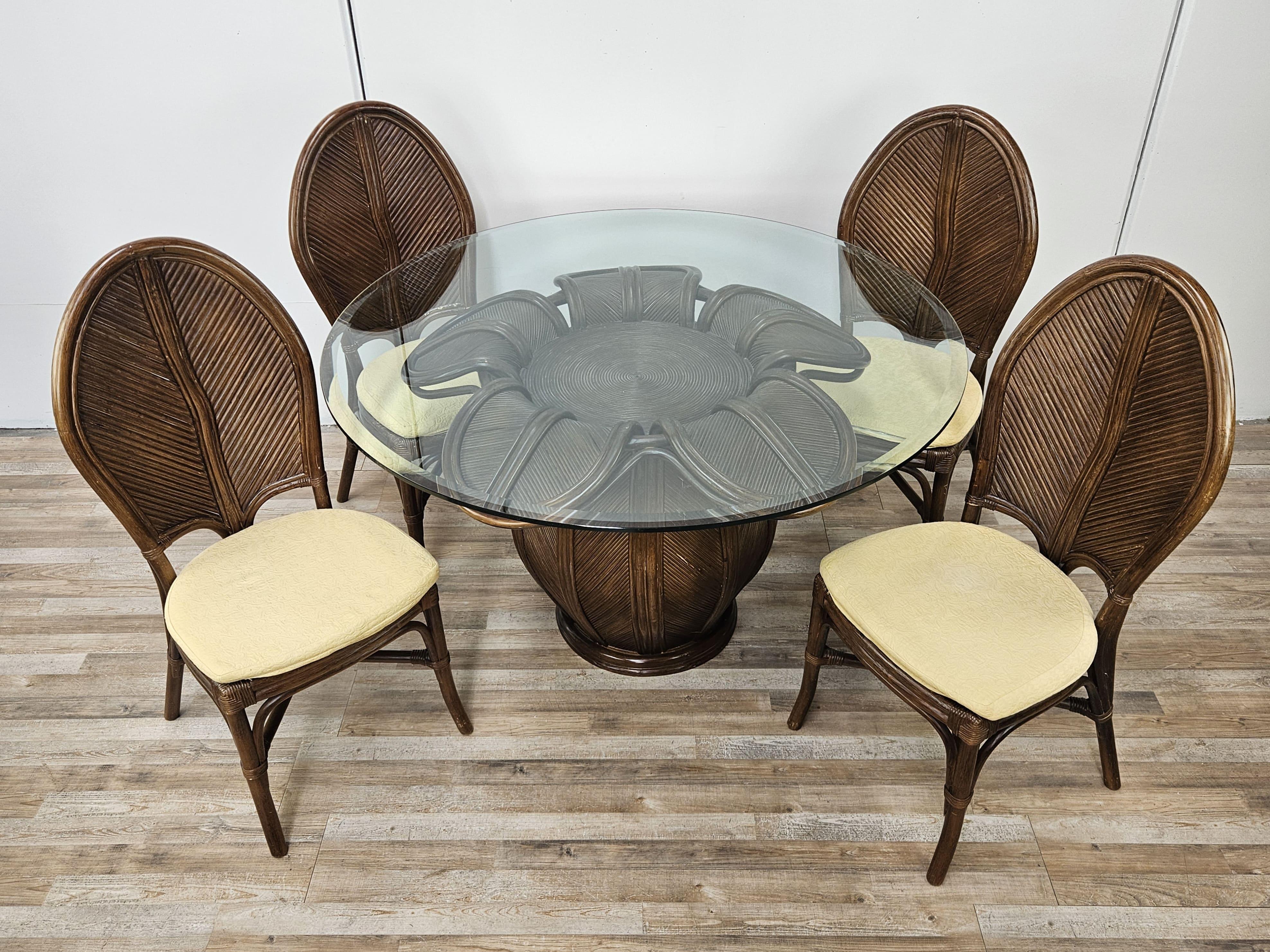 Vintage 1970s garden or patio set with table and four comfortable bamboo chairs.

Note the quality of the items; the glass is 1cm thick.

Ideal as a vintage garden dining set or also placed indoors in living rooms or lounges.

Chair measurements: