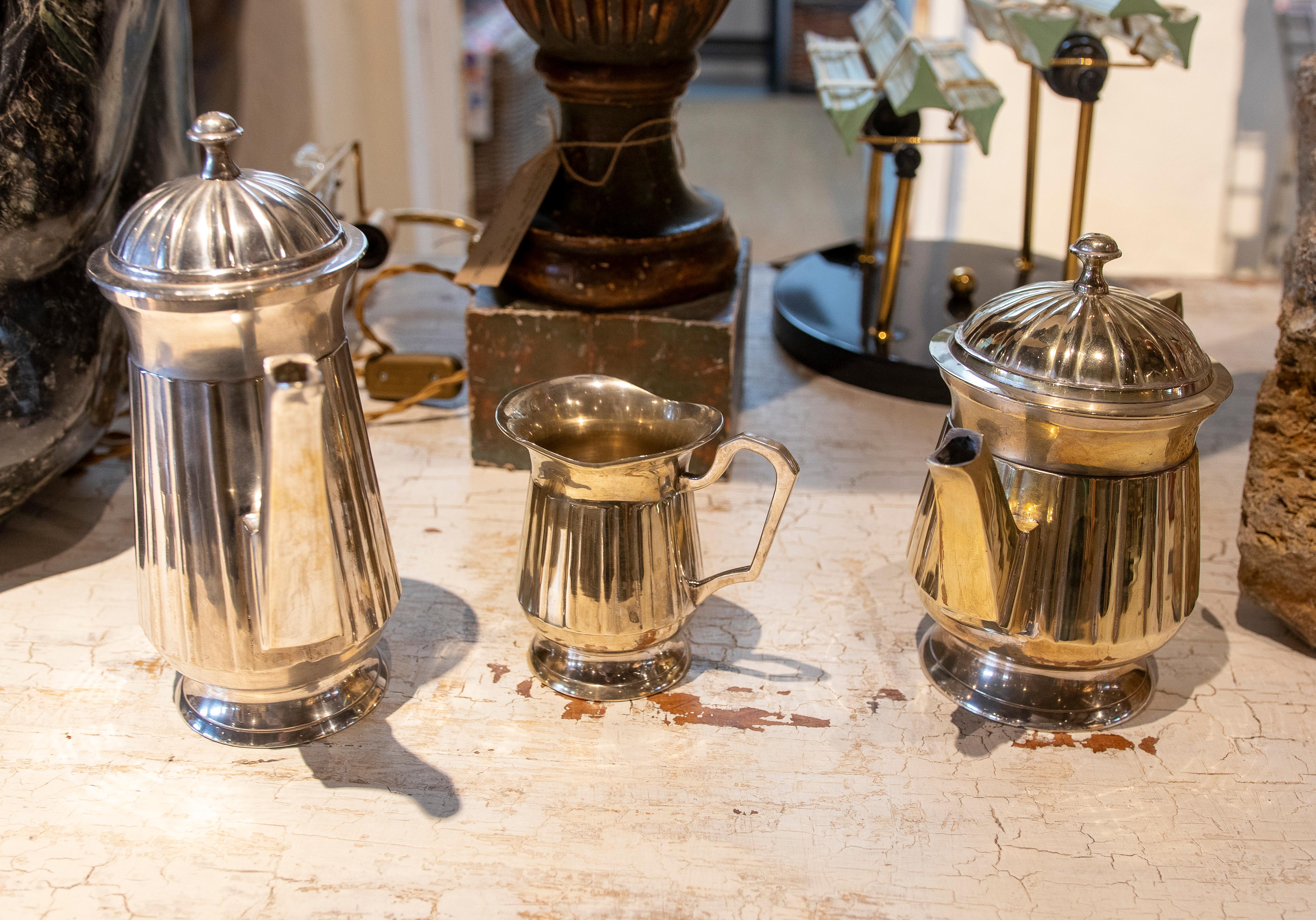 Set Consisting of Three Silver Plated Metal Coffee and Milk Jugs For Sale 8