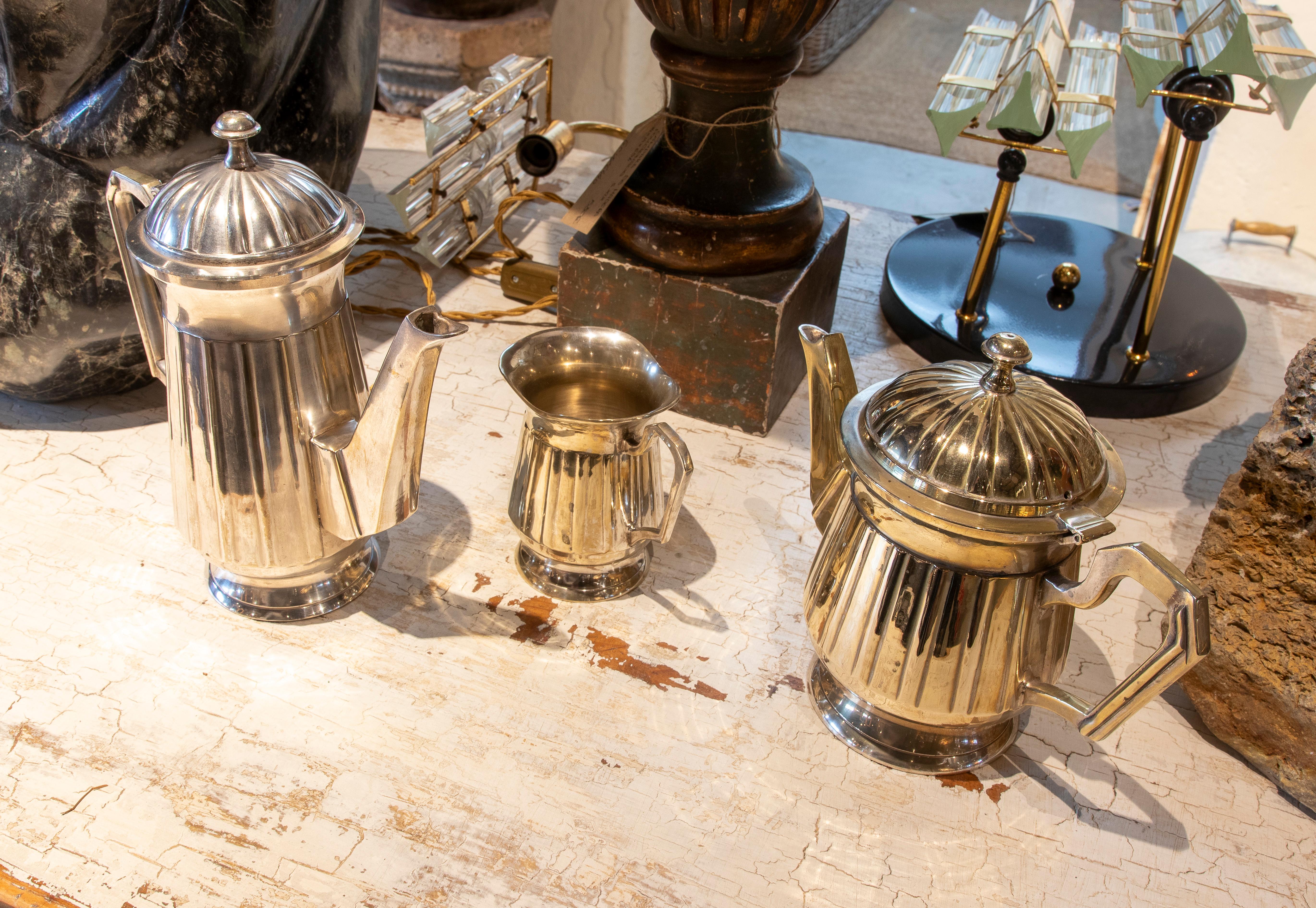 Metallic Thread Set Consisting of Three Silver Plated Metal Coffee and Milk Jugs For Sale
