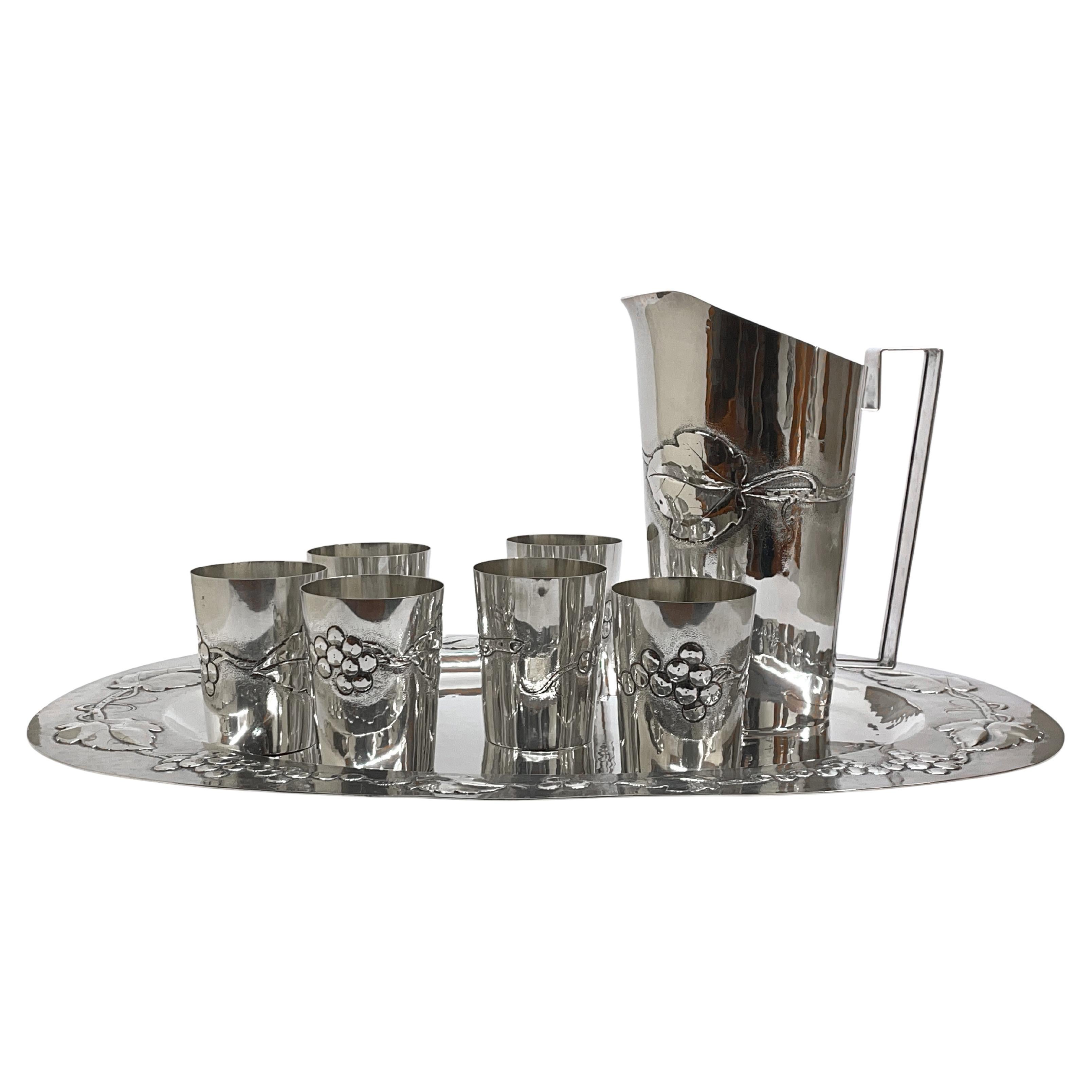 Set of 6 glasses, carafe and tray in chiseled silver, Brandimarte. For Sale