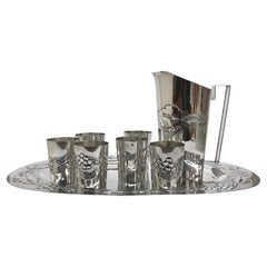 Set of 6 glasses, carafe and tray in chiseled silver, Brandimarte.